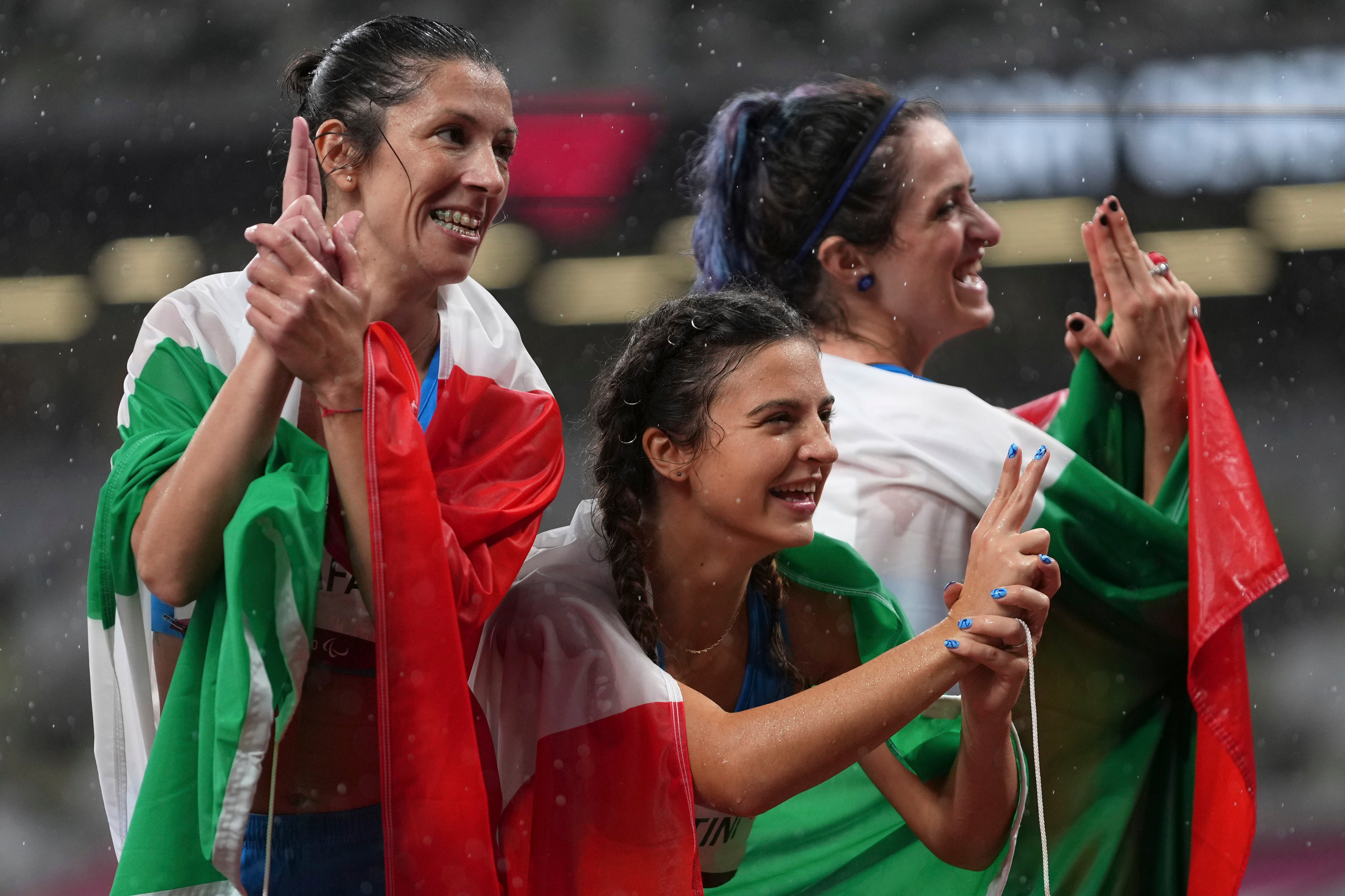 Italy’s Ambra Sabatini (centre), Martina Caironi (right) and Monica Graziana Contrafatto finished first, second and third respectively in the women’s T63 100 meters final (Emilio Morenatti/AP)