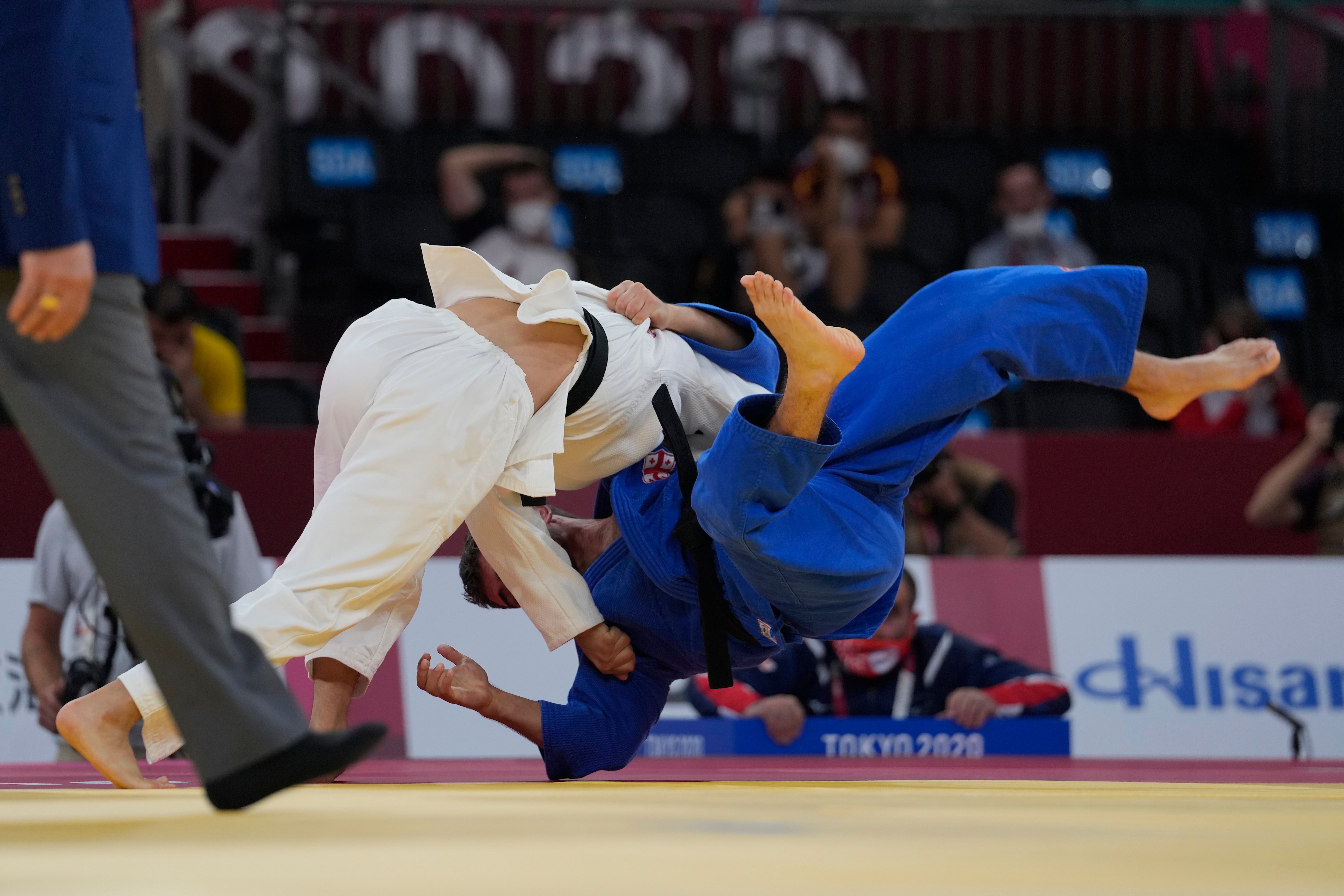 Japan’s Yujiro Seto (left) defeats Georgia’s Giorgi Gamjashvili in men’s 66kg judo bronze medal match (Kiichiro Sato/AP)