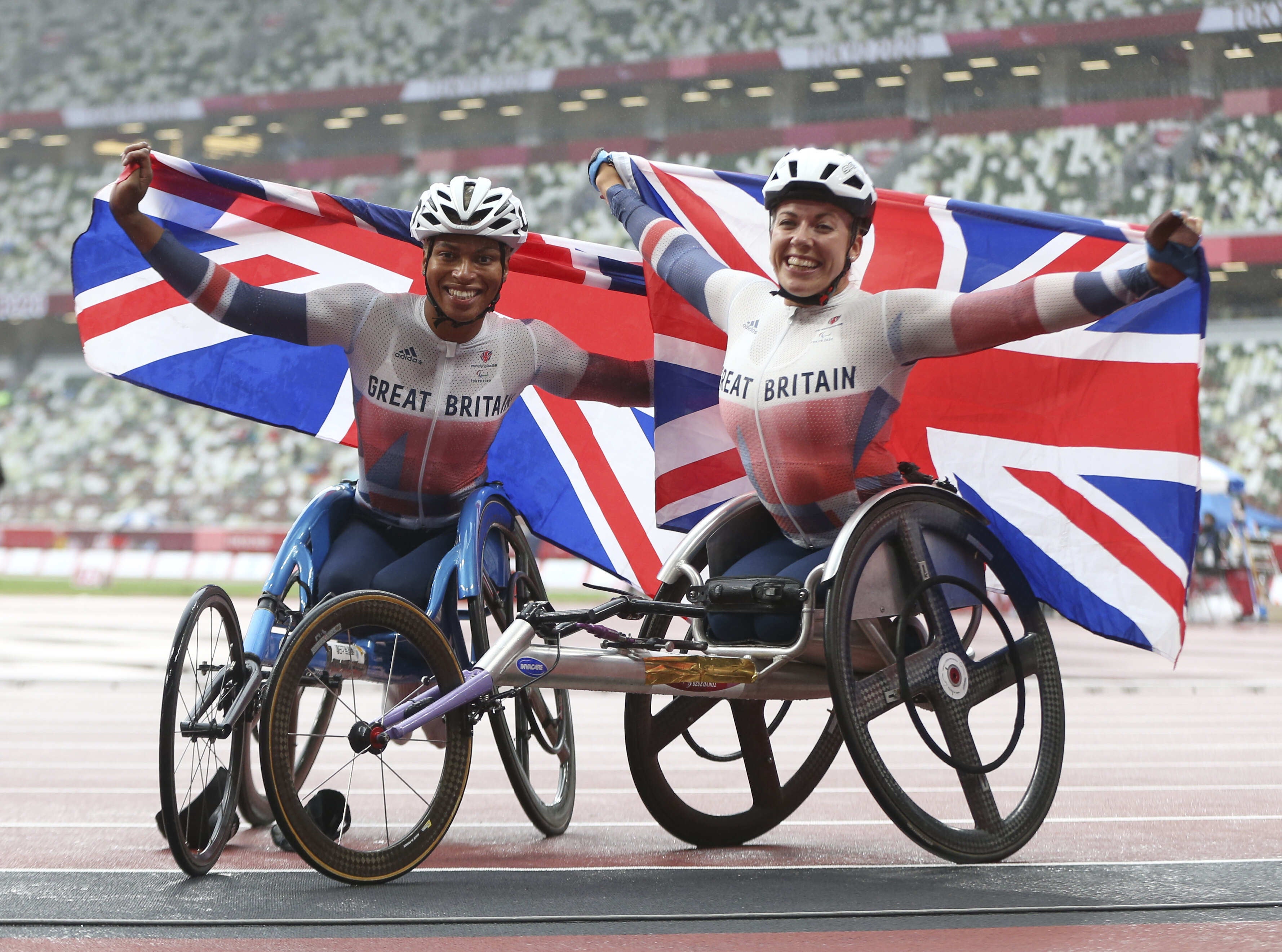 Hannah Cockroft (right) reacts to winning the women’s 800m T34 final with Kare Adenegan, who claimed silver (imagecommsralympicsGB/PA)