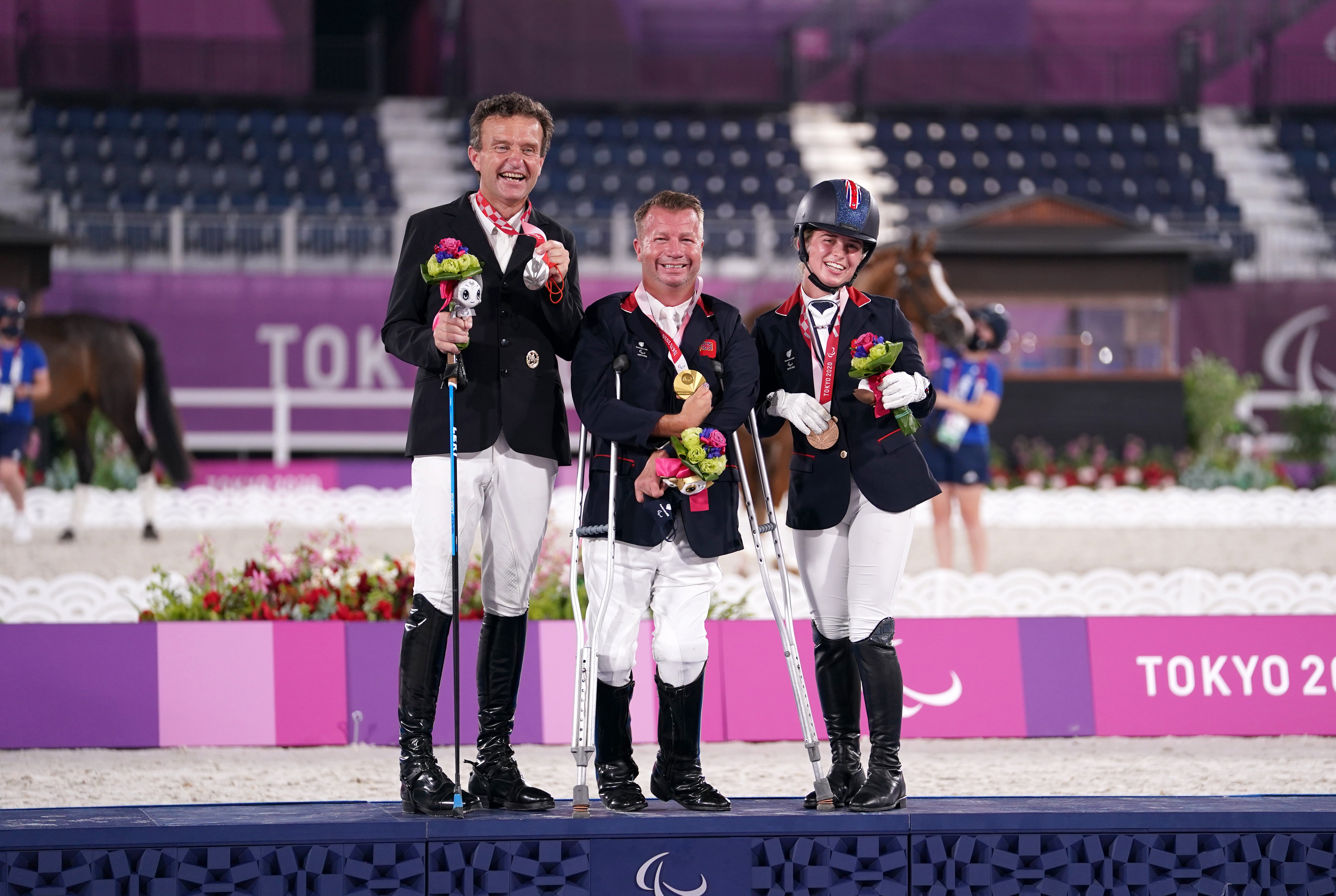 Sir Lee Pearson (centre) with his gold medal after winning the dressage individual (grade two) alongside second-placed Pepo Such of Austria and third-placed ParalympicsGB team-mate Georgia Wilson (John Walton/PA)