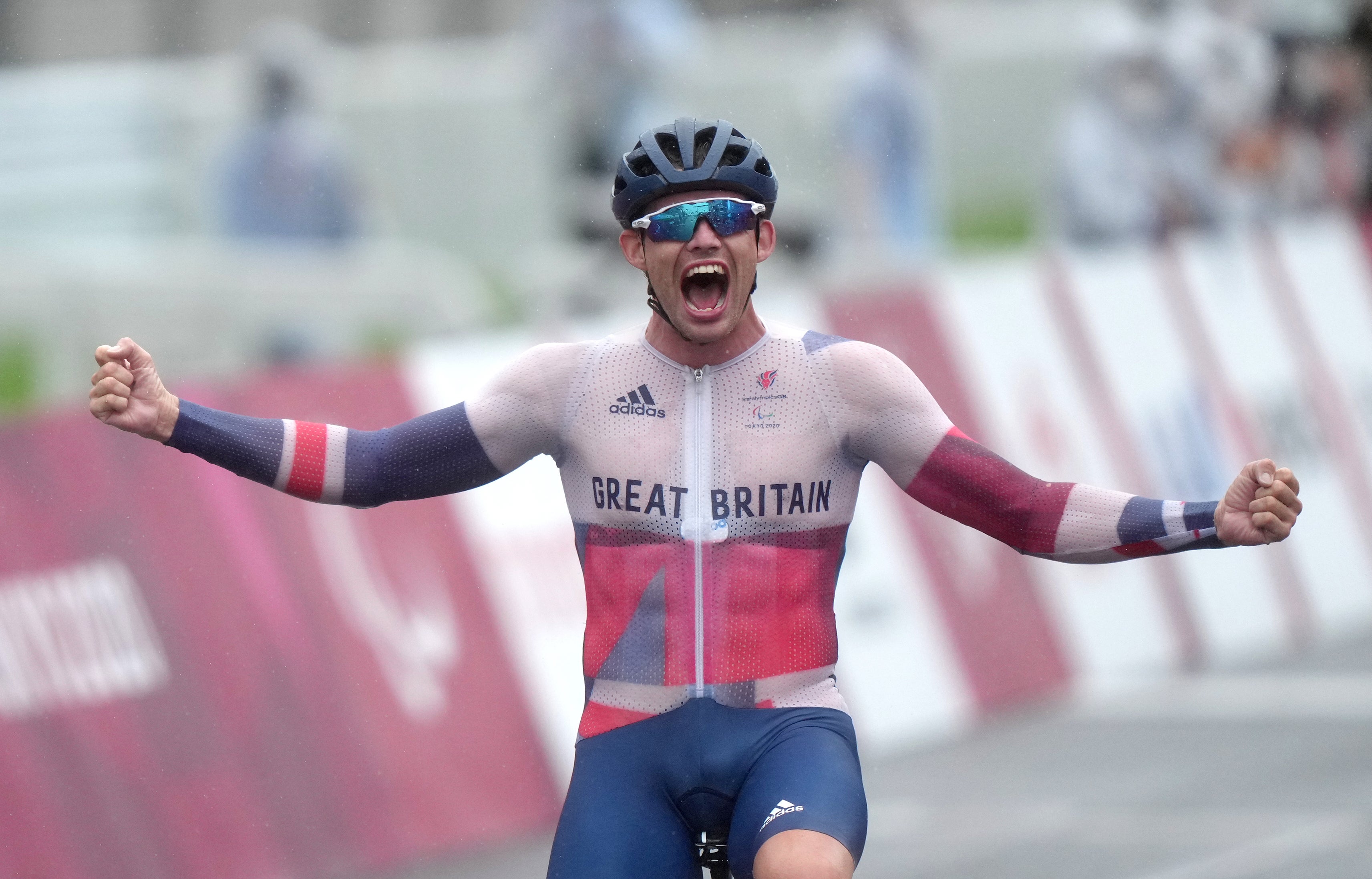 Ben Watson celebrates winning the men’s C1-3 road race (Tim Goode/PA)