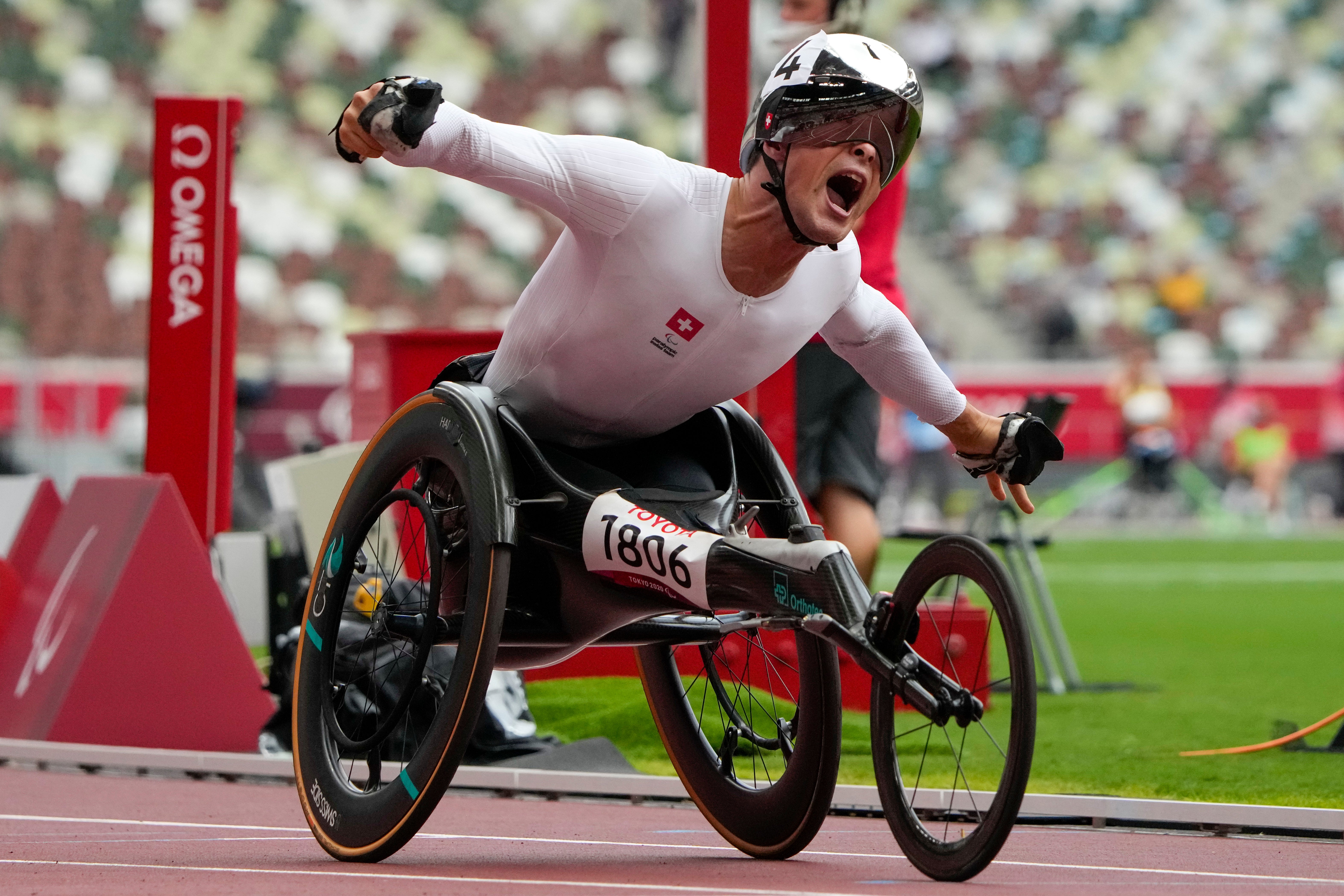 Marcel Hug reacts to winning the men’s T54 1500m final (Eugene Hoshiko/AP)