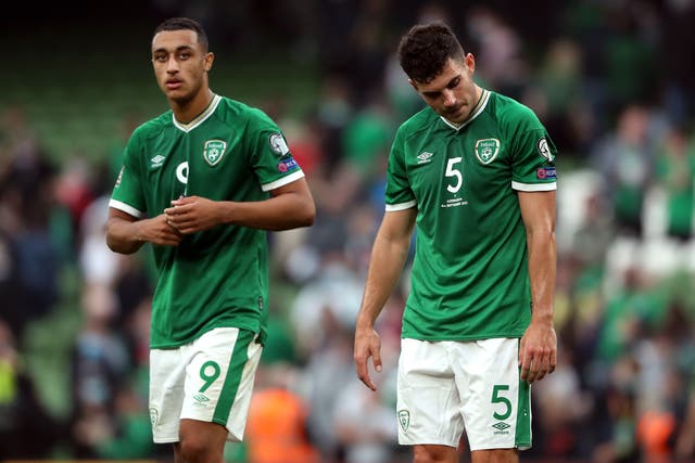 Republic of Ireland’s John Egan and Adam Idah, left, appear dejected after the World Cup qualifier draw with Azerbaijan (Niall Carson/PA)