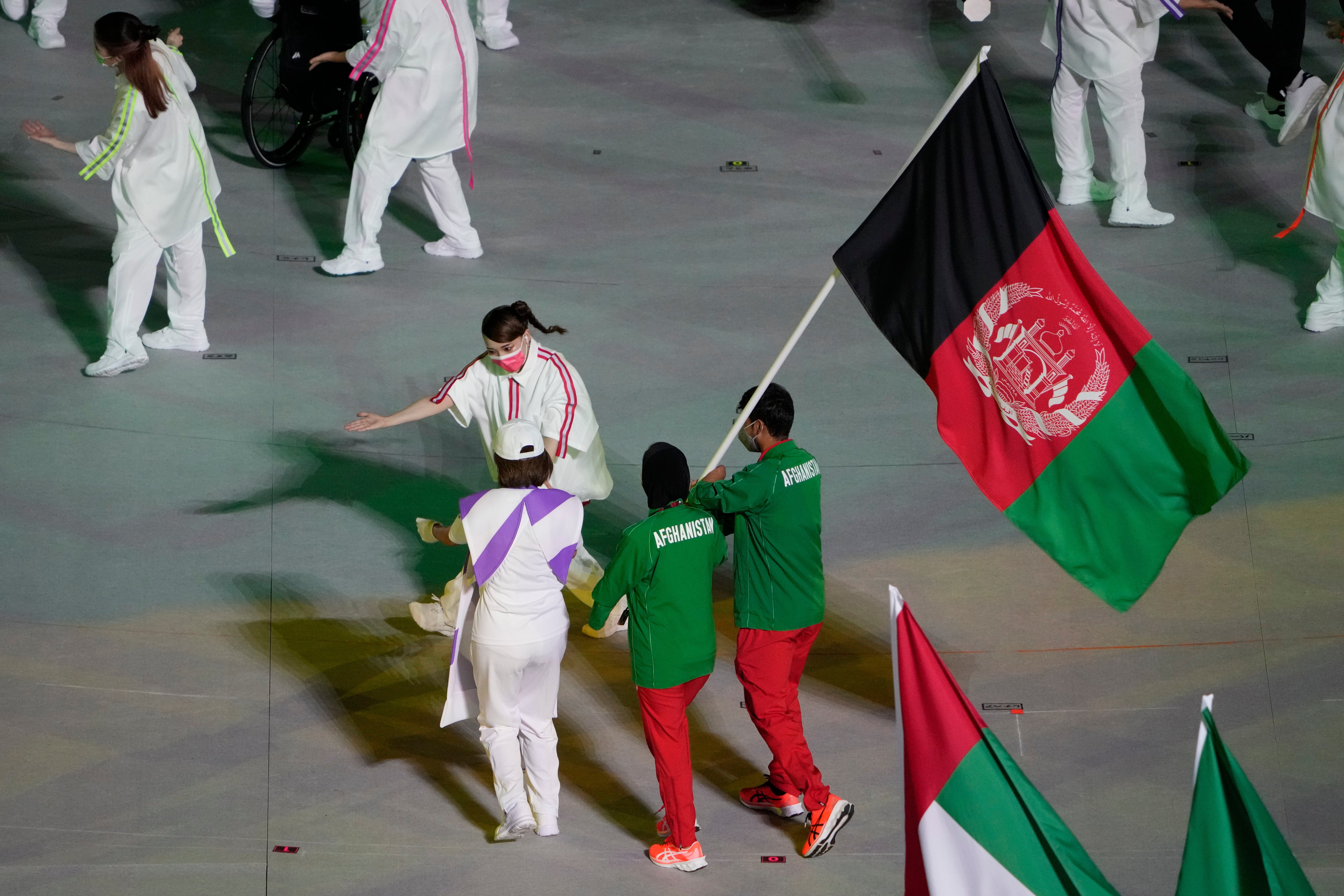 Athletes from Afghanistan during the closing ceremony in Tokyo (Eugene Hoshiko/AP)