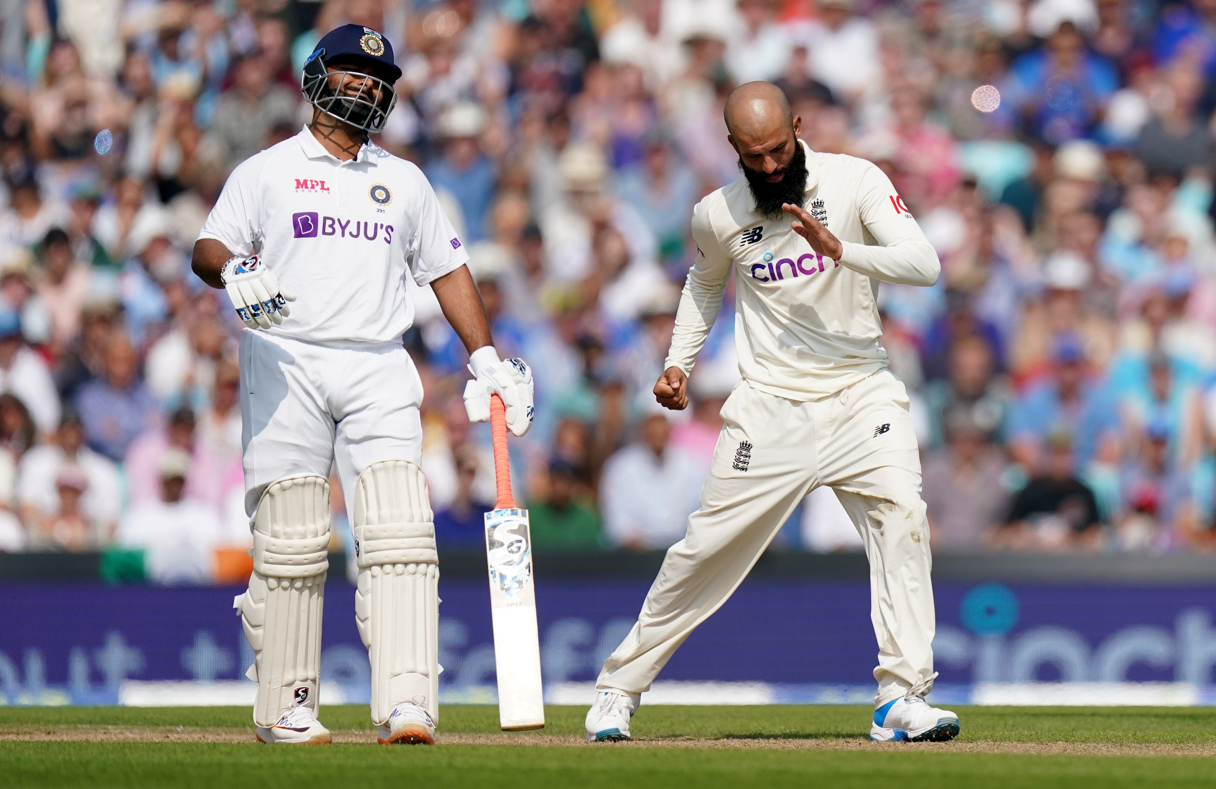England’s Moeen Ali celebrates taking the wicket of India’s Virat Kohli (Adam Davy/PA)