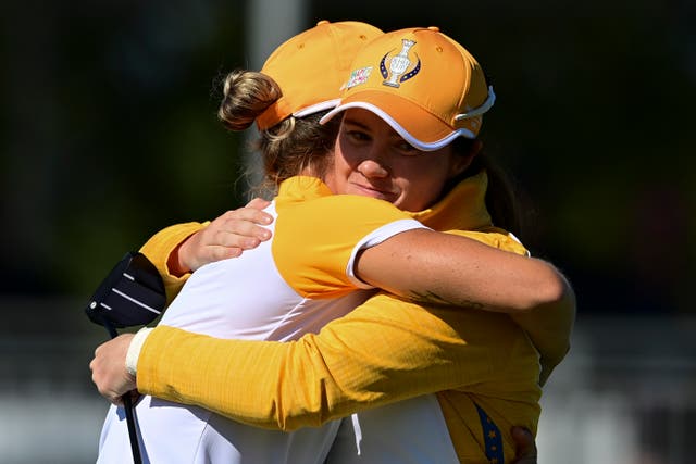 Leona Maguire (right) and Mel Reid celebrate their win against the USA in Sunday’s foursomes in the 17th Solheim Cup (David Dermer/AP)
