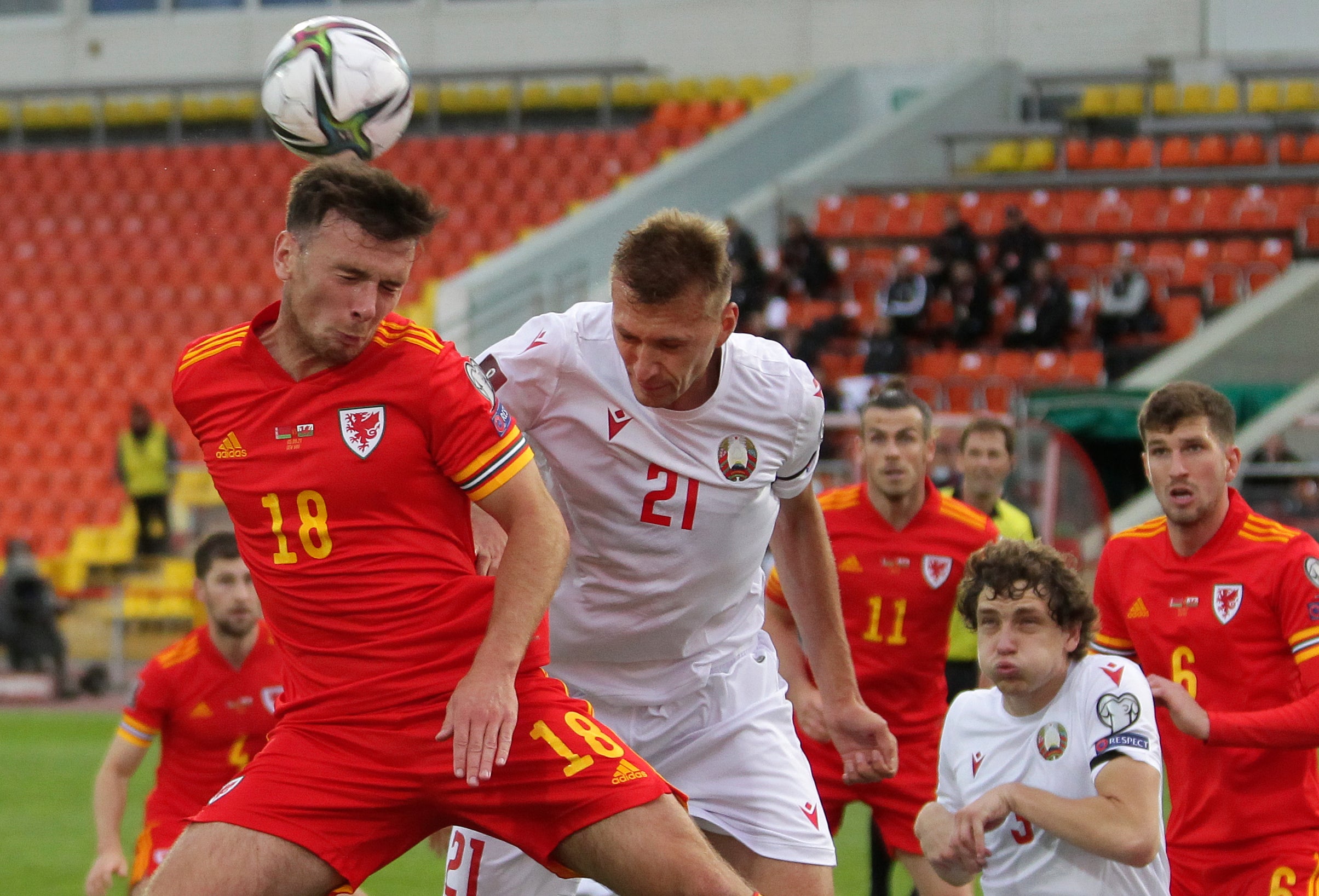 Wales substitute Mark Harris (left) heads goalwards against Belarus (Alexey Nasyrov/AP)