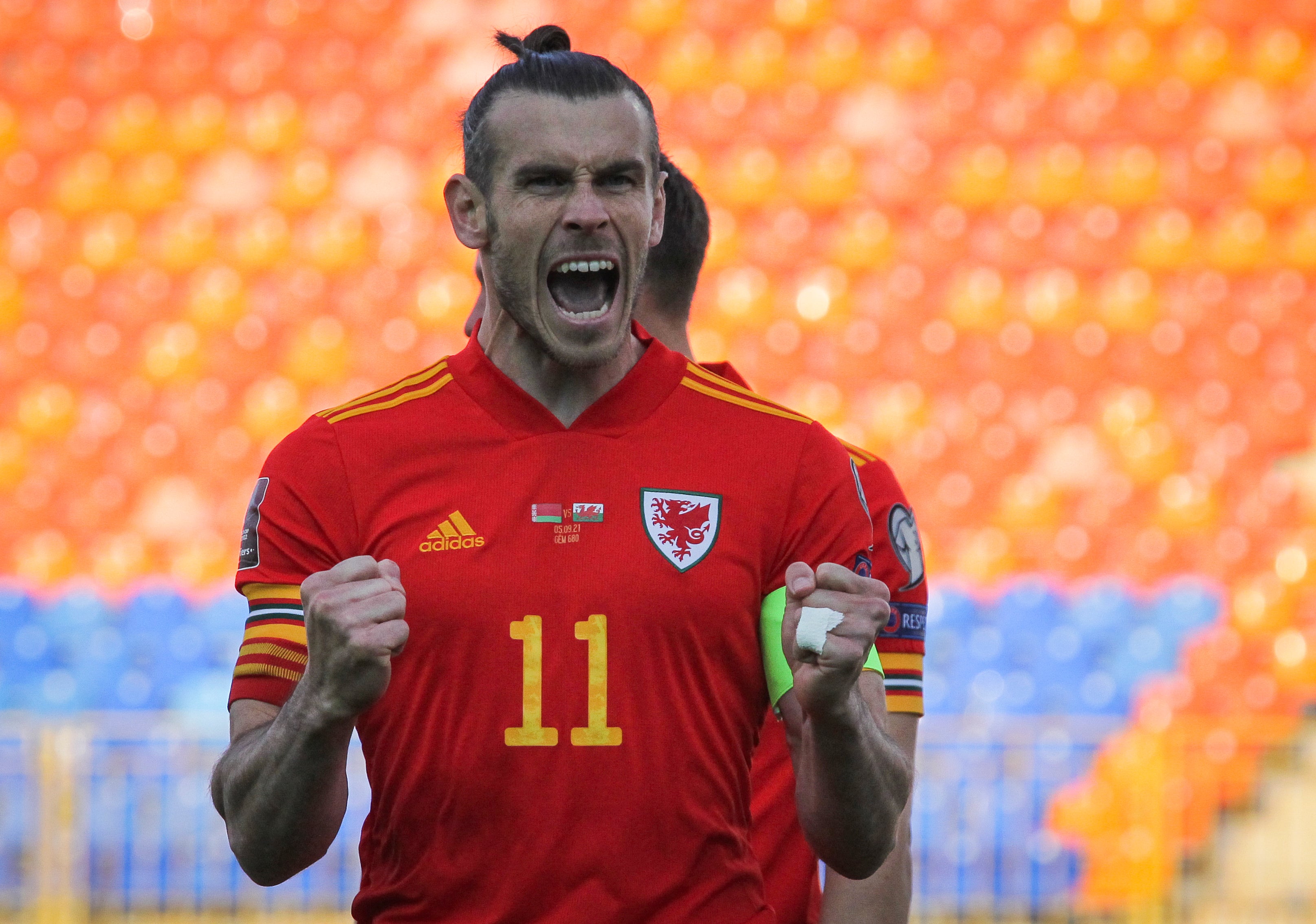 Wales captain Gareth Bale celebrates his side’s World Cup qualifying victory over Belarus (Alexei Nasyrov/AP)