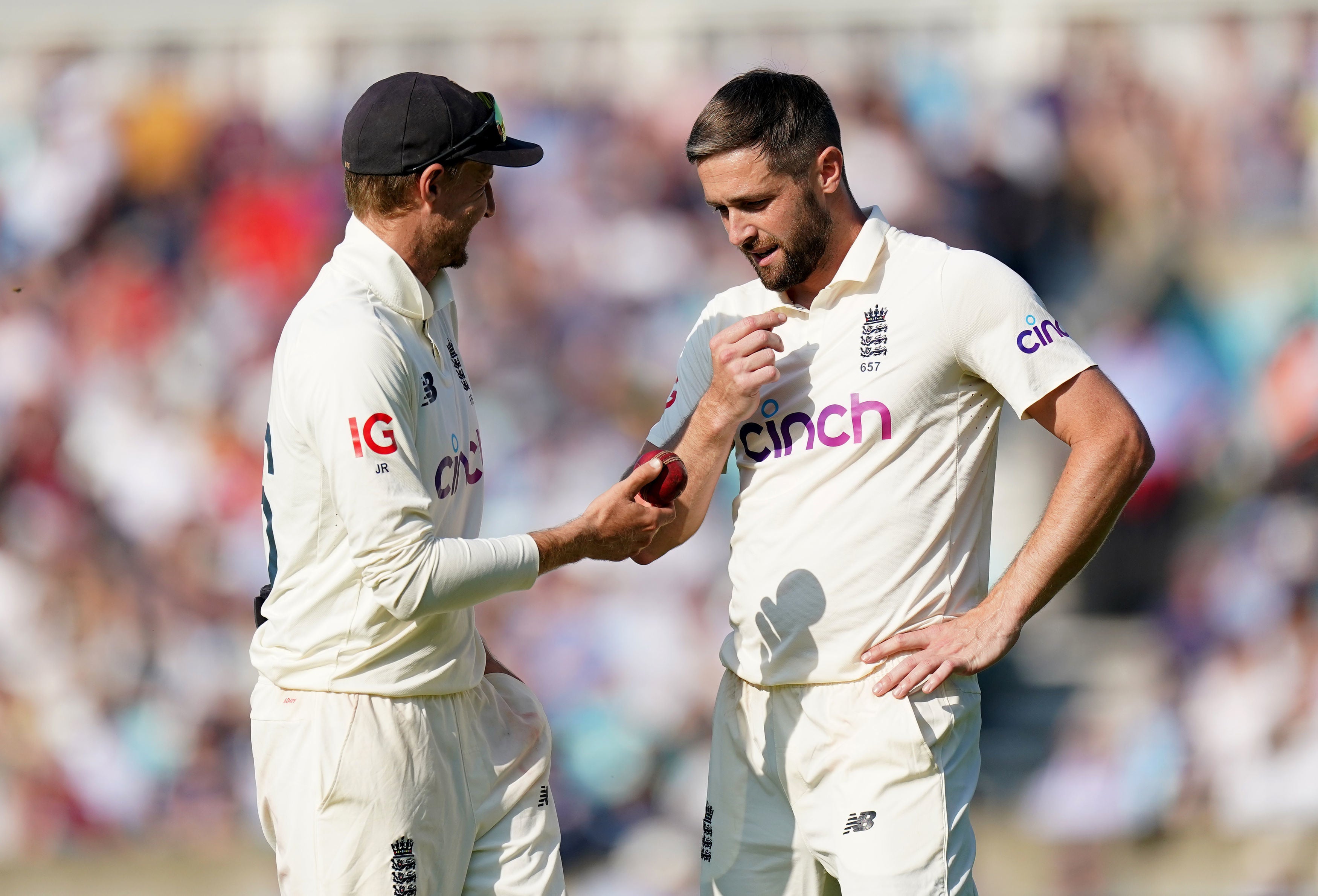 Chris Woakes, right, with captain Joe Root