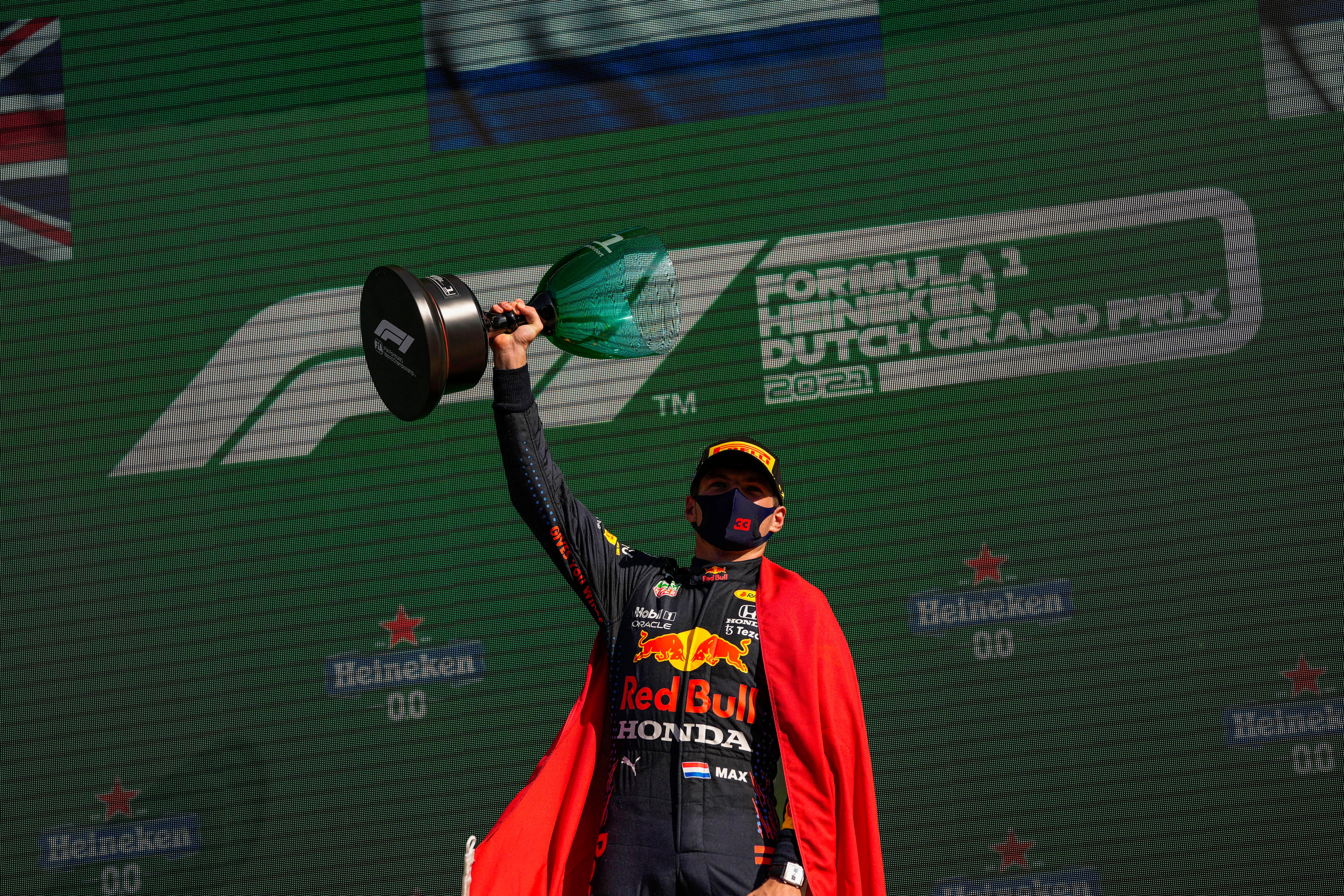 Red Bull driver Max Verstappen celebrates his victory at the Dutch Grand Prix (Francisco Seco/AP)