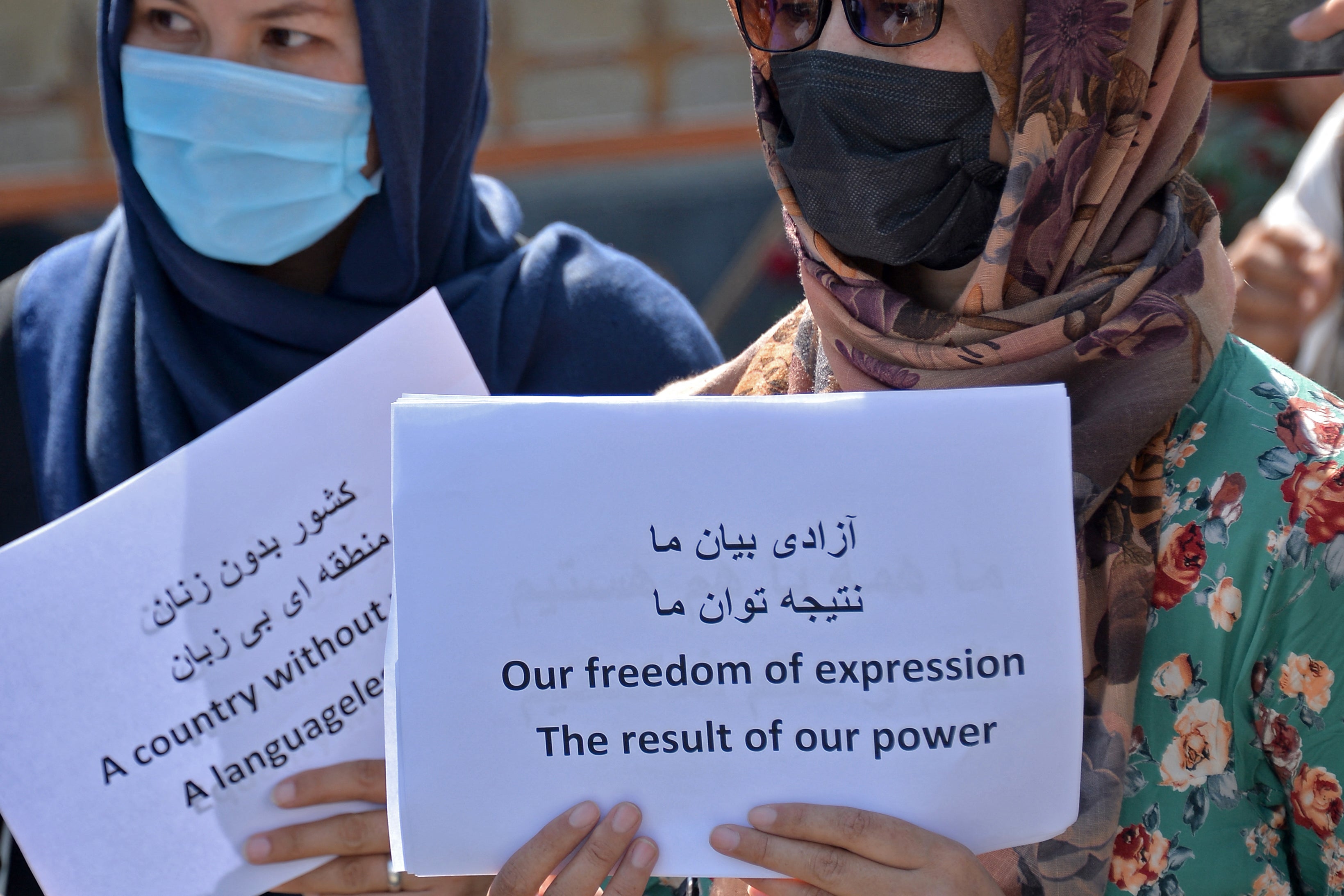 Afghan women take part in a protest march for their rights under the Taliban rule in the downtown area of Kabul on 3 September 2021