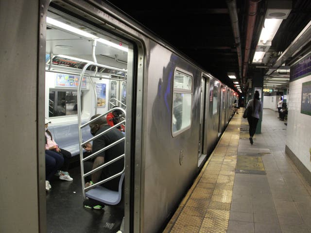 <p>Train platforms in New York City’s  subway system do not currently have barriers blocking passengers from the tracks </p>