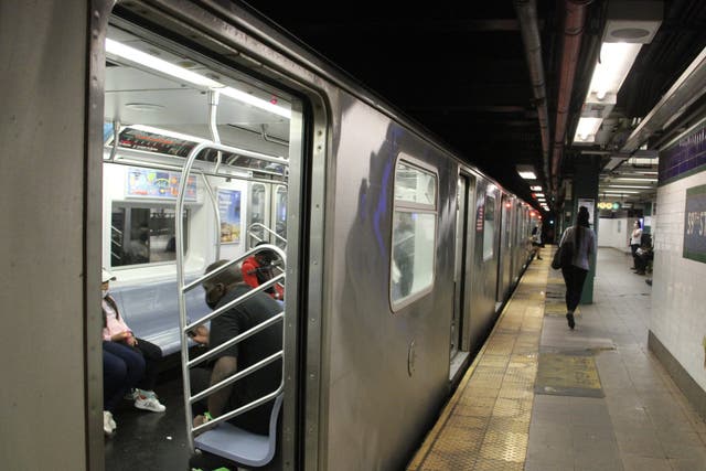 <p>Train platforms in New York City’s  subway system do not currently have barriers blocking passengers from the tracks </p>
