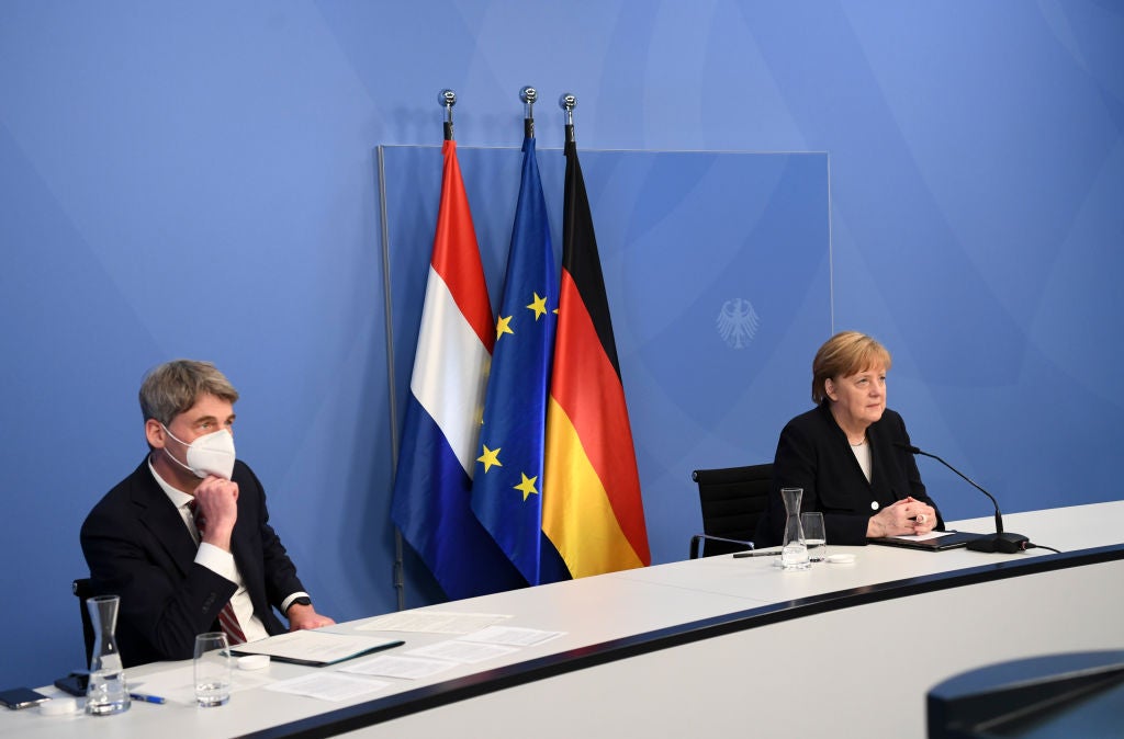 Jan Hecker with Angela Merkel at a virtual event with Dutch PM Mark Rutte marking Liberation Day, the end of the occupation by Nazi Germany during World War Two