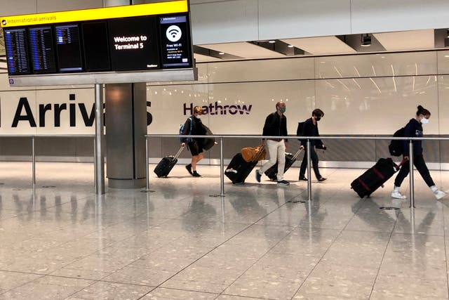 <p>Waiting game: Arrivals at Heathrow airport Terminal 5</p>