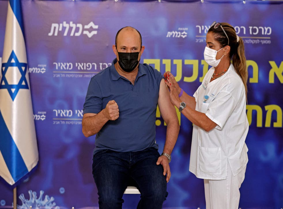<p>Israeli Prime Minister Naftali Bennett receiving his first Covid-19 booster shot in August </p>