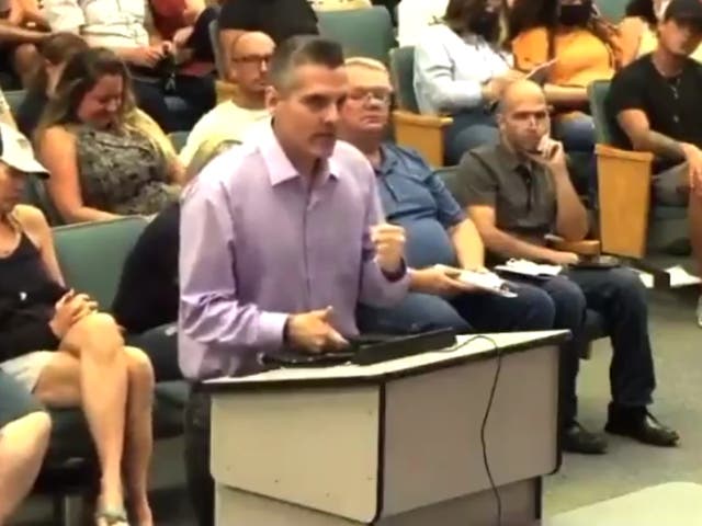 <p>A parent at a school board meeting in Seminole County, Florida</p>