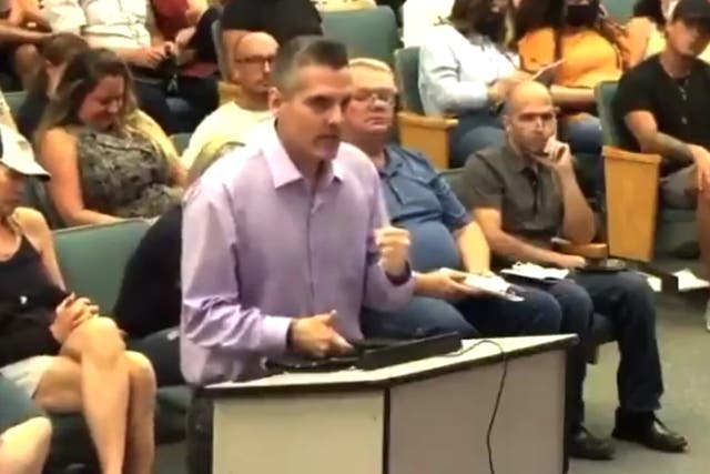 <p>A parent at a school board meeting in Seminole County, Florida</p>