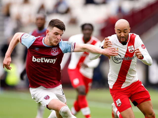 <p>West Ham’s Declan Rice (left) vies for the ball with Southampton’s Nathan Redmond</p>