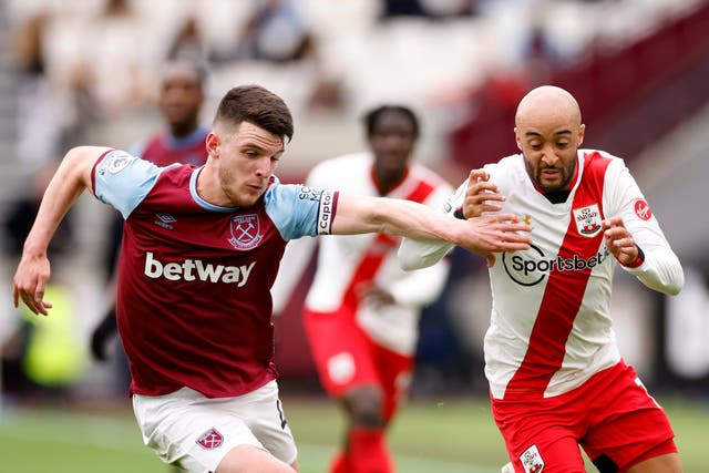 <p>West Ham’s Declan Rice (left) vies for the ball with Southampton’s Nathan Redmond</p>