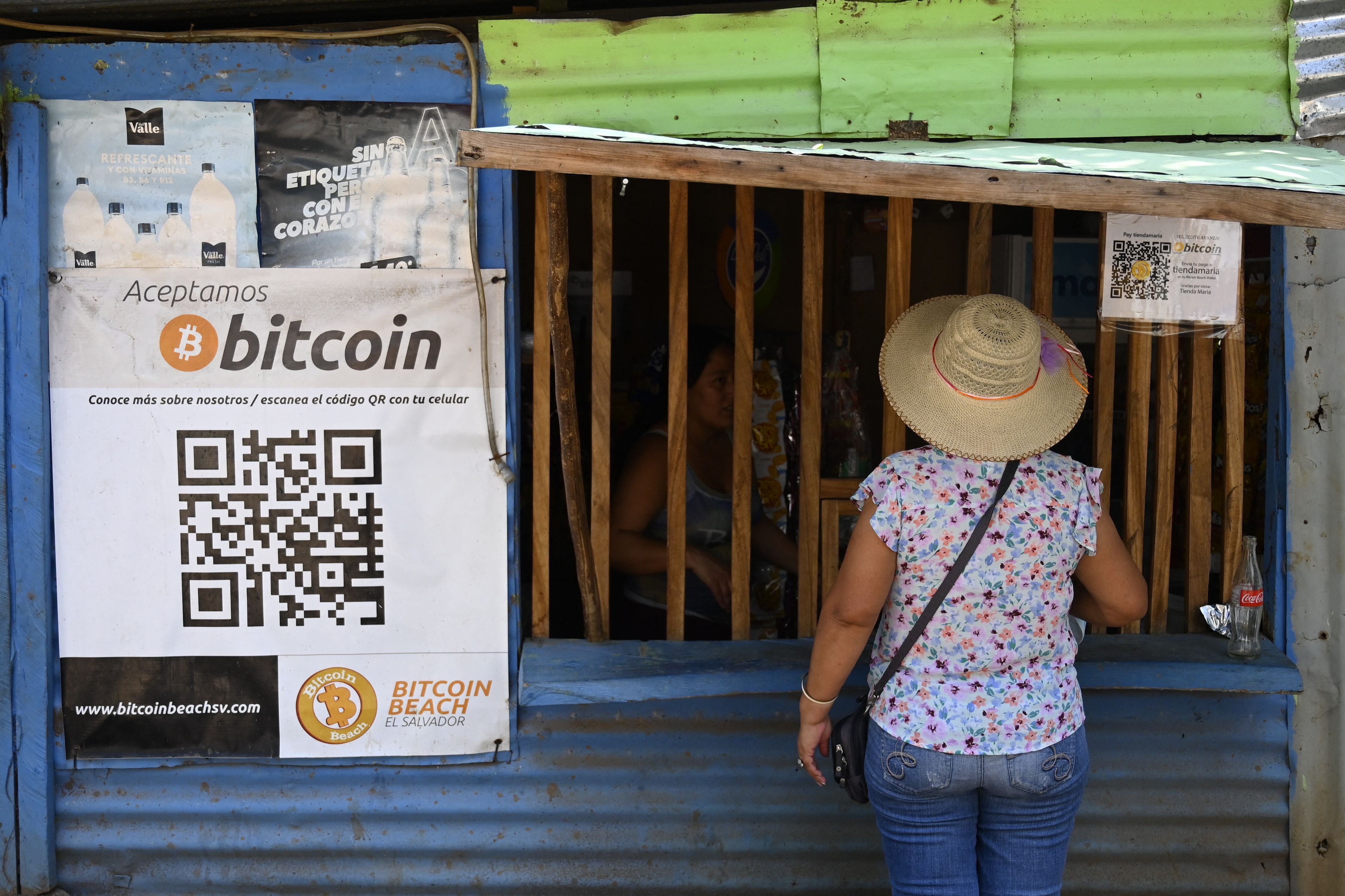 A woman outside a store that accepts bitcoins in El Zonte, La Libertad, El Salvador on 4 September 2021