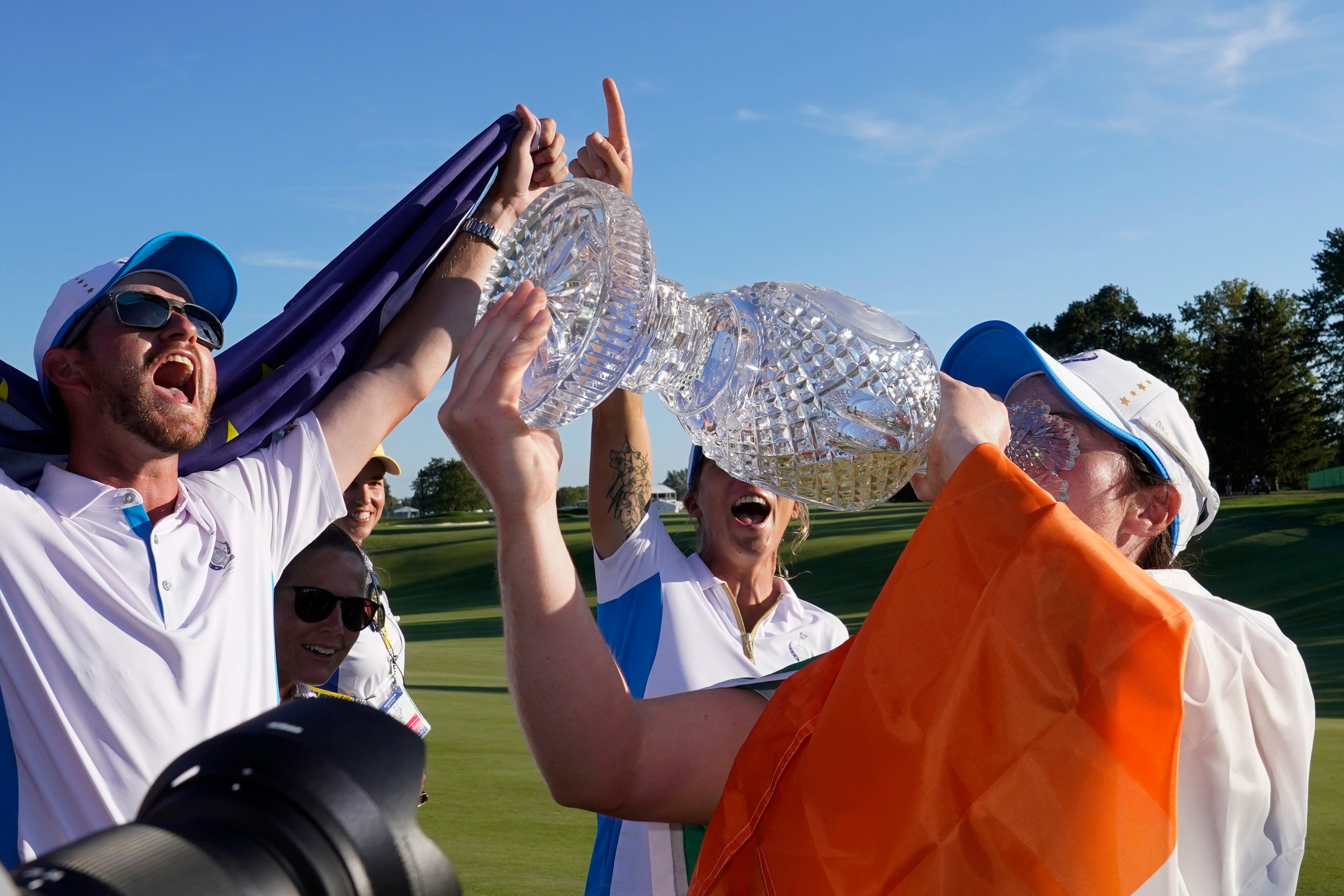 Europe’s Leona Maguire drinks from the Solheim Cup after victory over the United States in Toledo (Carlos Osorio/AP)