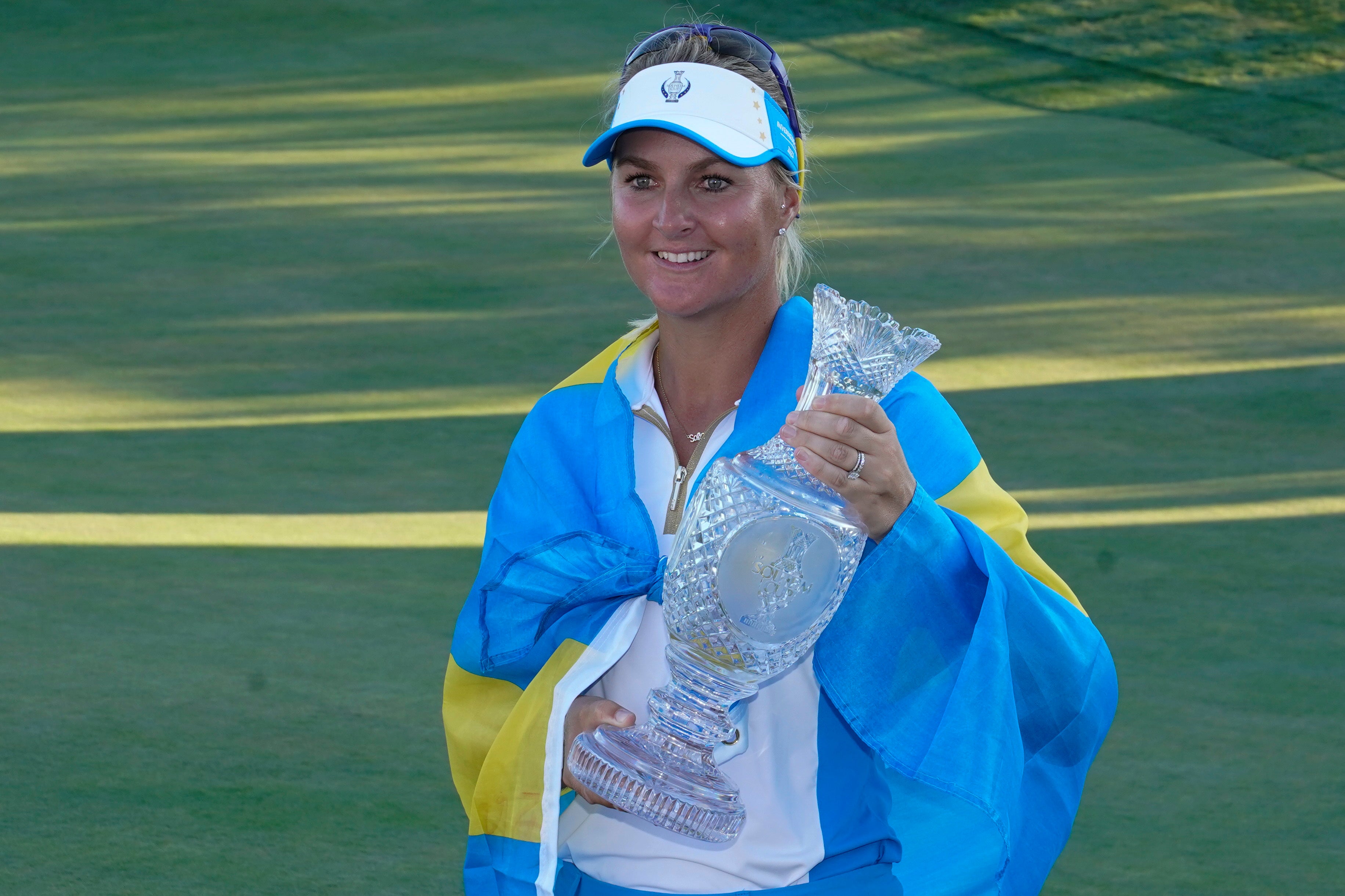 Europe’s Anna Nordqvist holds the trophy after their team defeated the United States at the Solheim Cup (Carlos Osorio/AP)