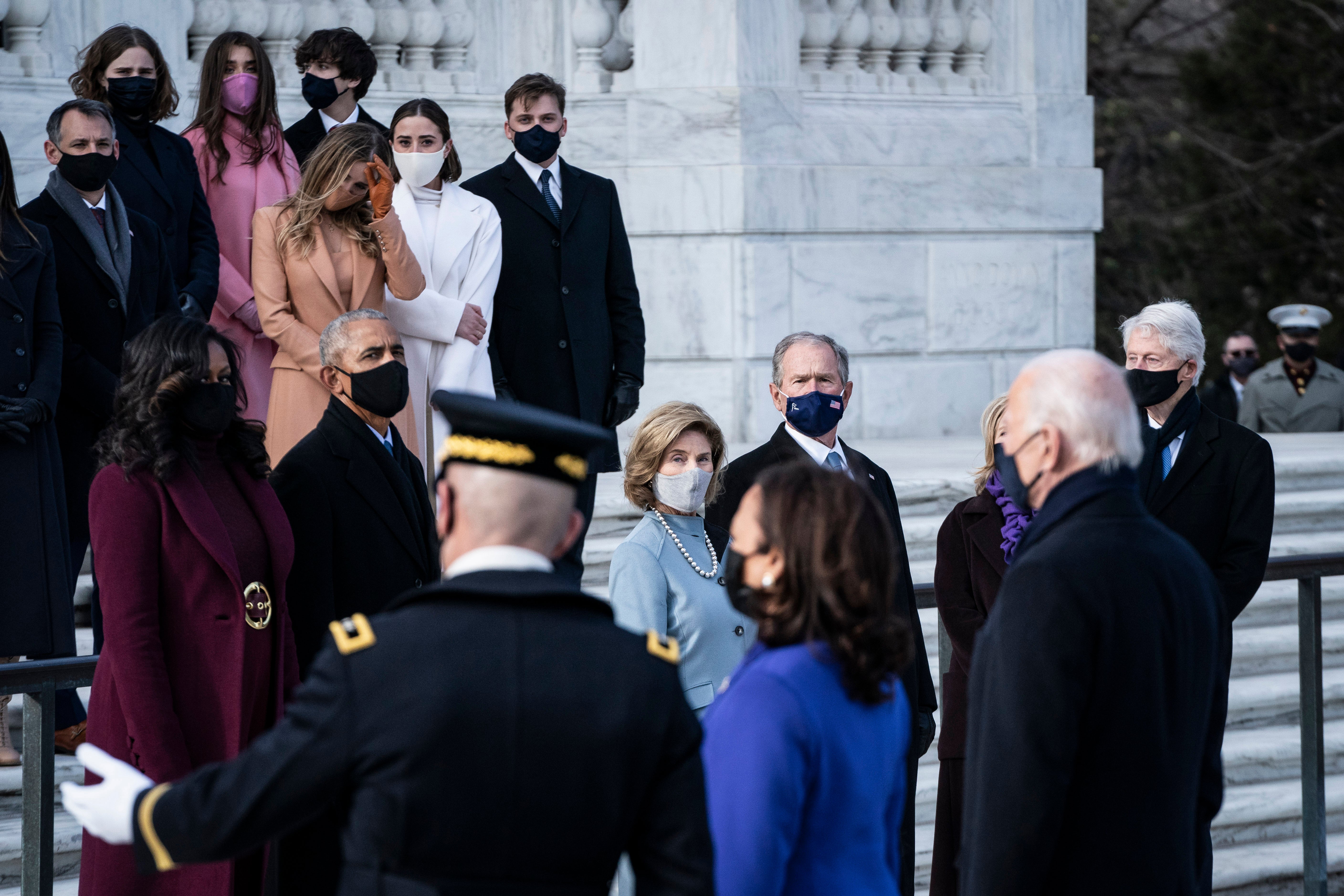 Bush and his wife, Laura, participate in a wreath-laying ceremony at the Tomb of the Unknown Soldier at Arlington National Cemetery, Virginia, on 20 January 2021