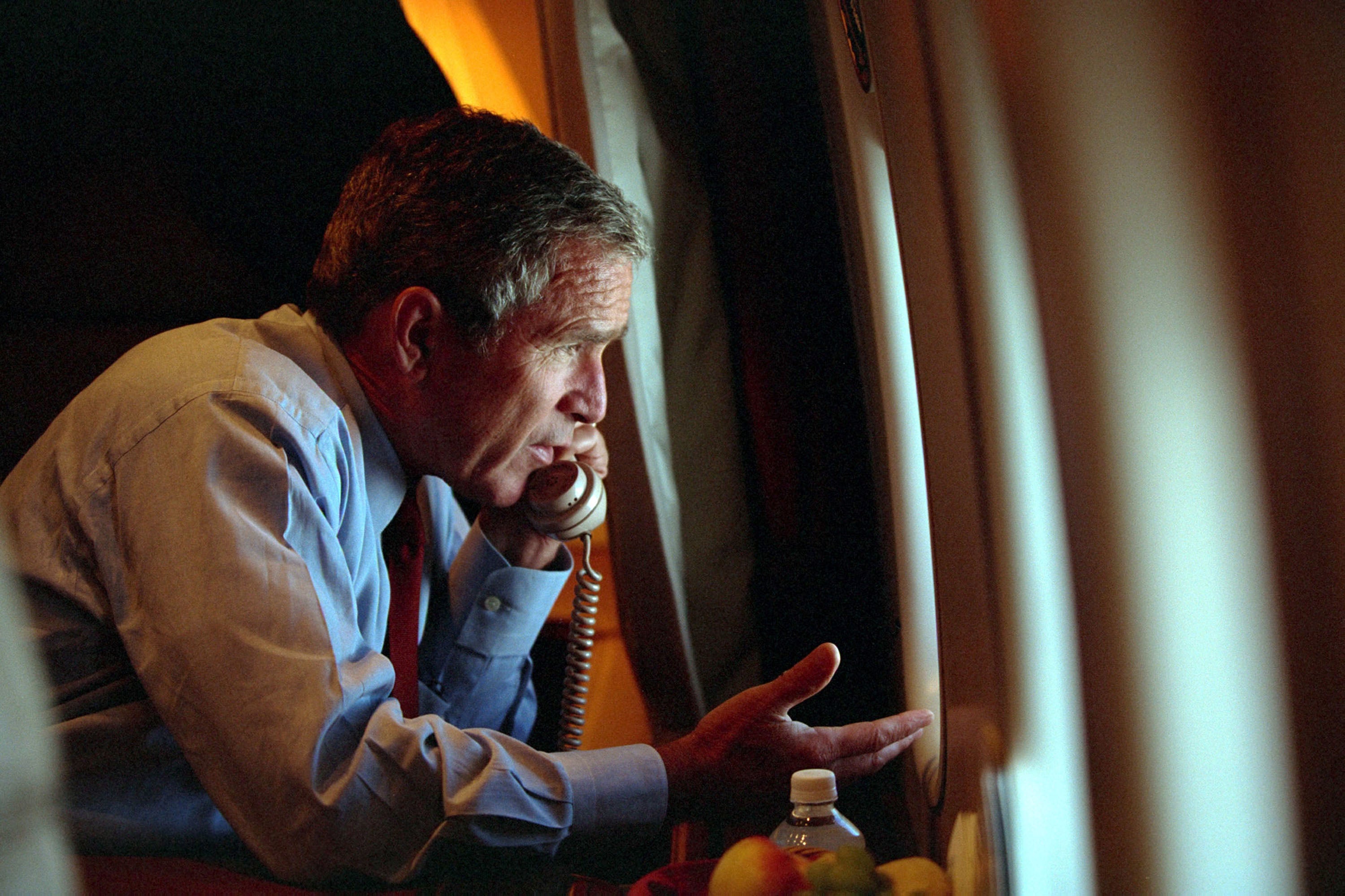 Bush speaks to Vice President Dick Cheney by phone aboard Air Force One on 11 September 2001 after departing Offutt Air Force Base in Nebraska