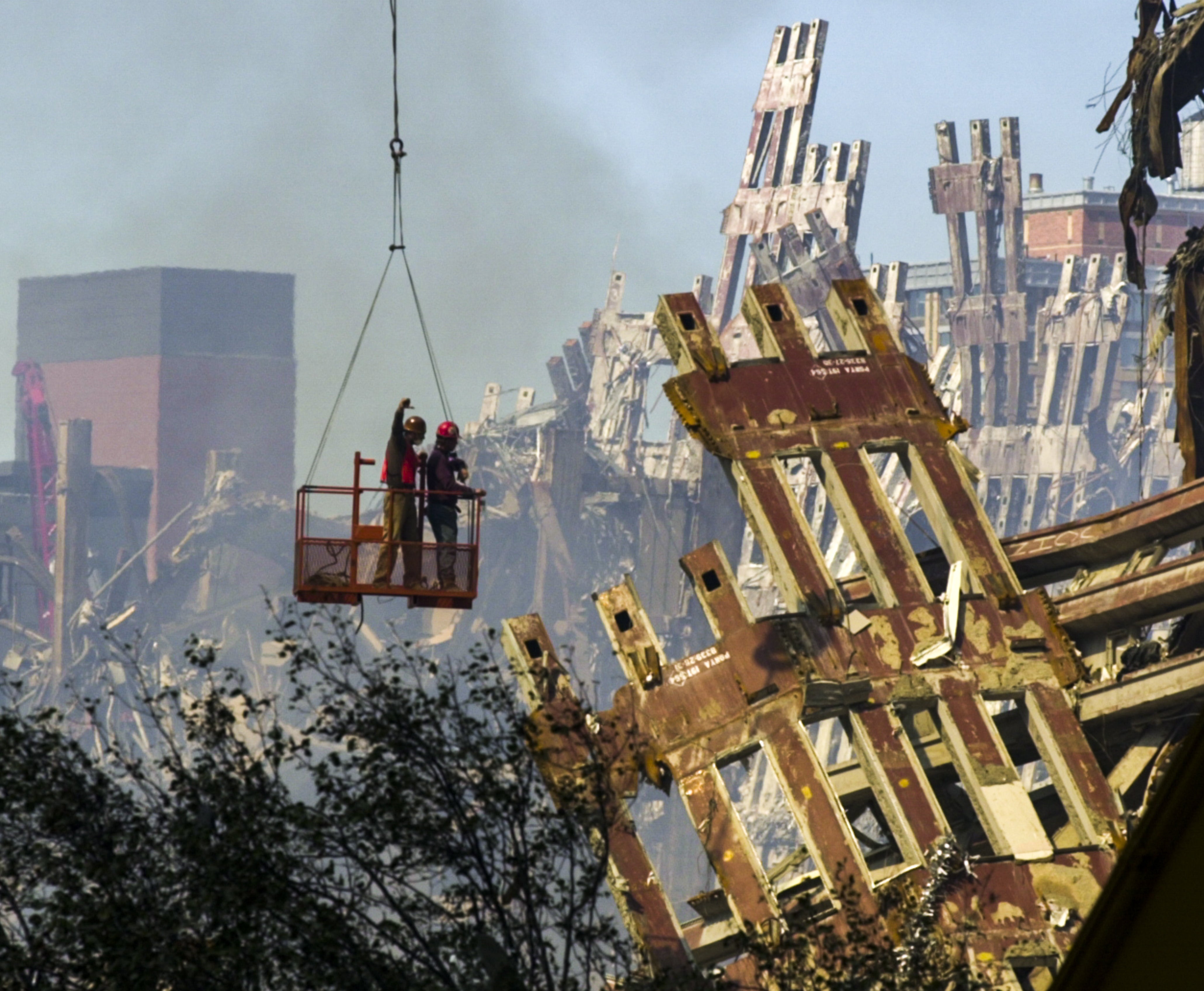 Workmen begin the task of dismantling the destroyed remains World Trade Centre building