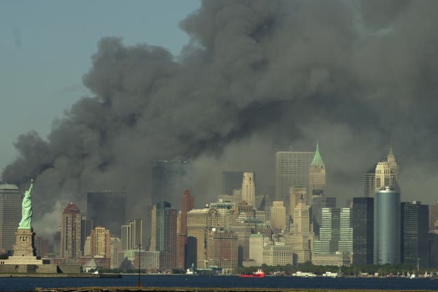 <p>Thick smoke billows into the sky from where the World Trade Center towers stood on 11 September 2001</p>