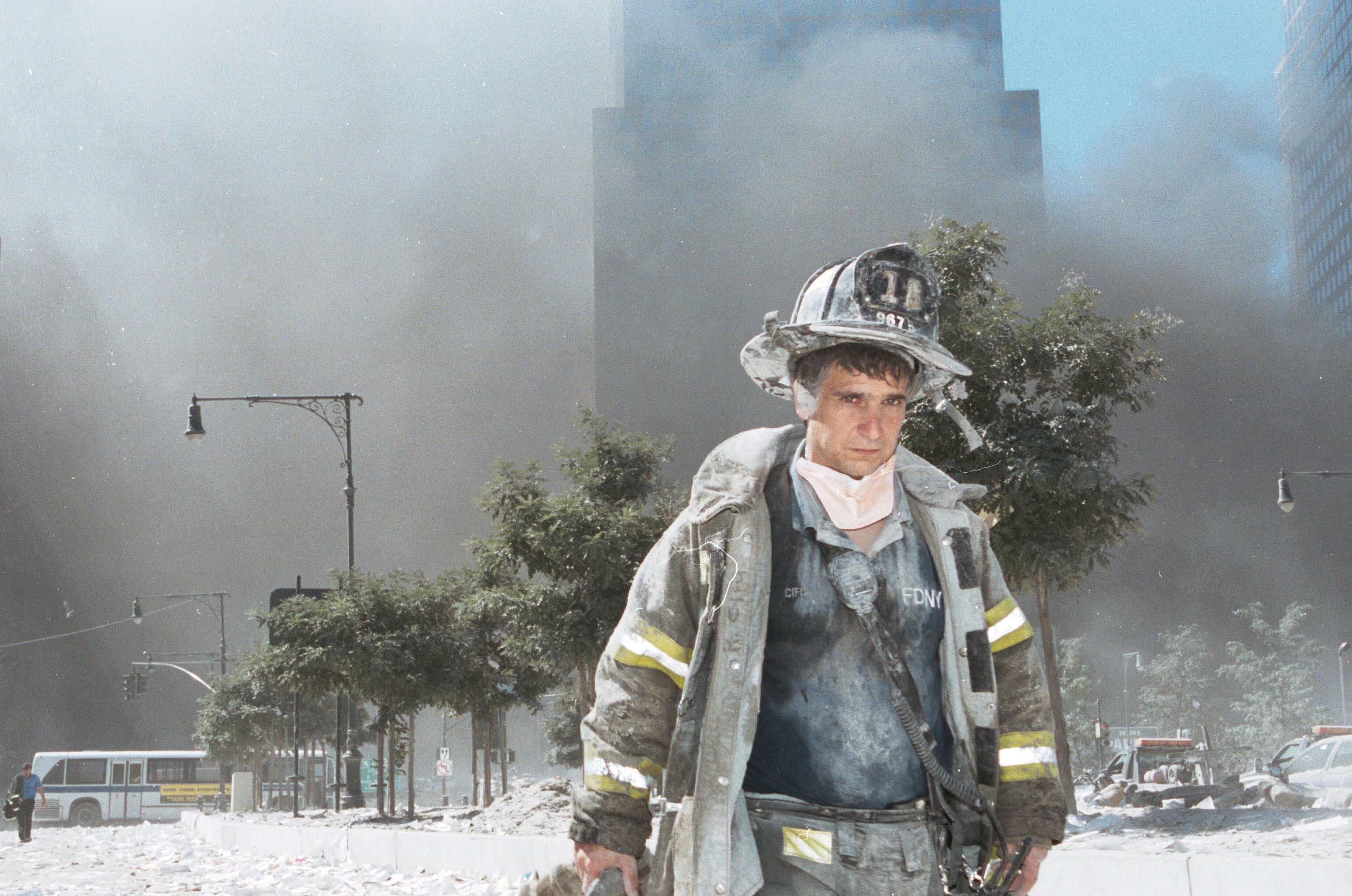 An unidentified New York City firefighter walks away after the collapse of the Twin Towers