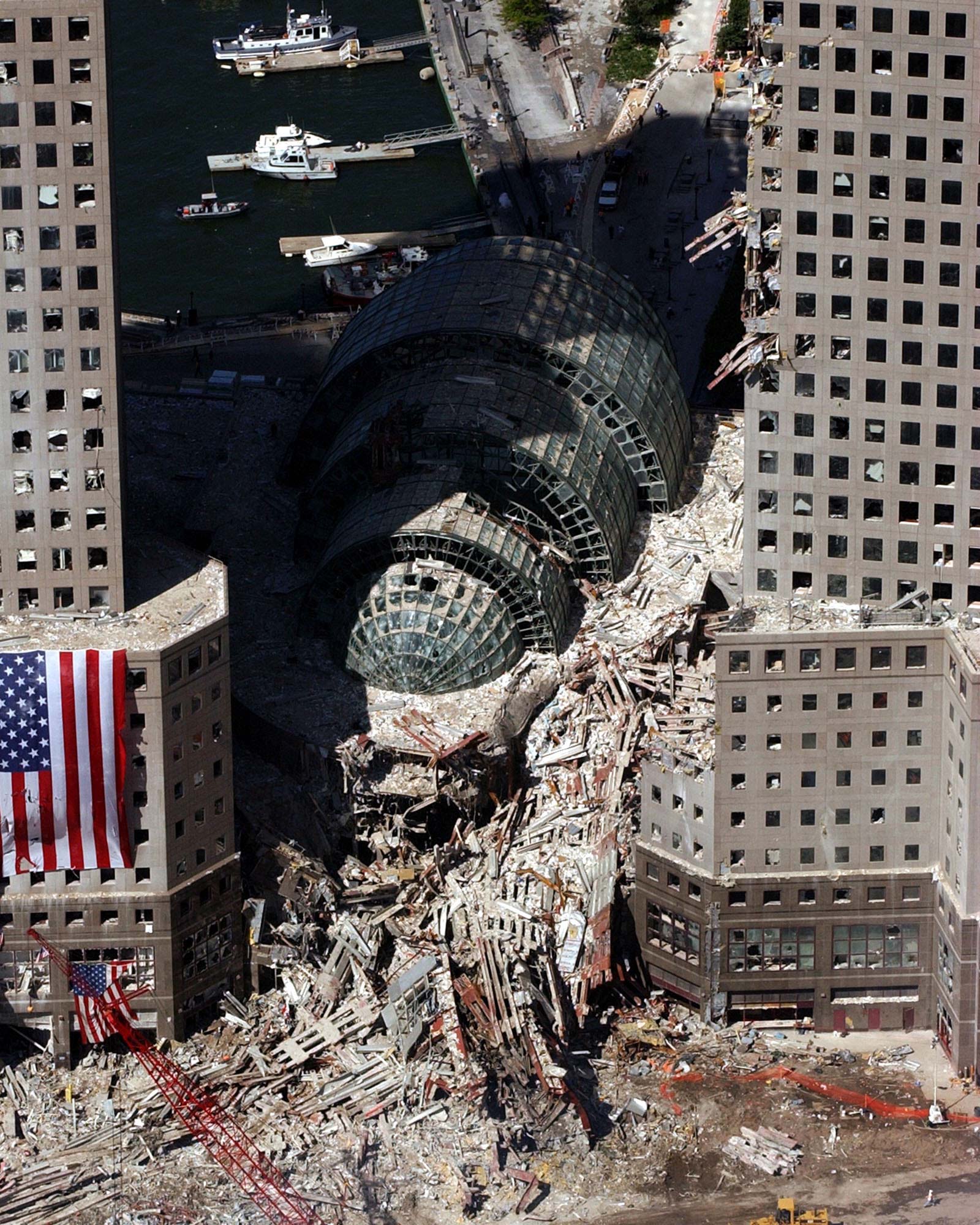 The Winter Garden surrounded by debris. Buildings nearby were heavily damaged by the falling twin towers
