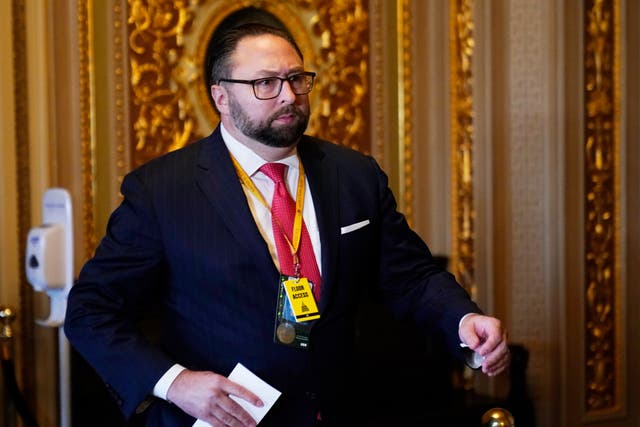 <p>Jason Miller, Senior Adviser to the Trump 2020 re-election campaign, walks in on the first day of former President Donald Trump's second impeachment trial </p>