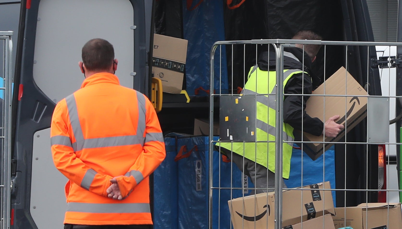 Electric delivery vans are packed at the Amazon warehouse in Belfast (Niall Carson/PA Wire)