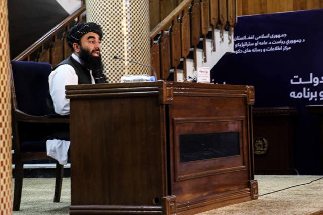 <p>Zabhiullah Mujahid, the Taliban spokesperson, talks with journalists as he announces the interim government</p>