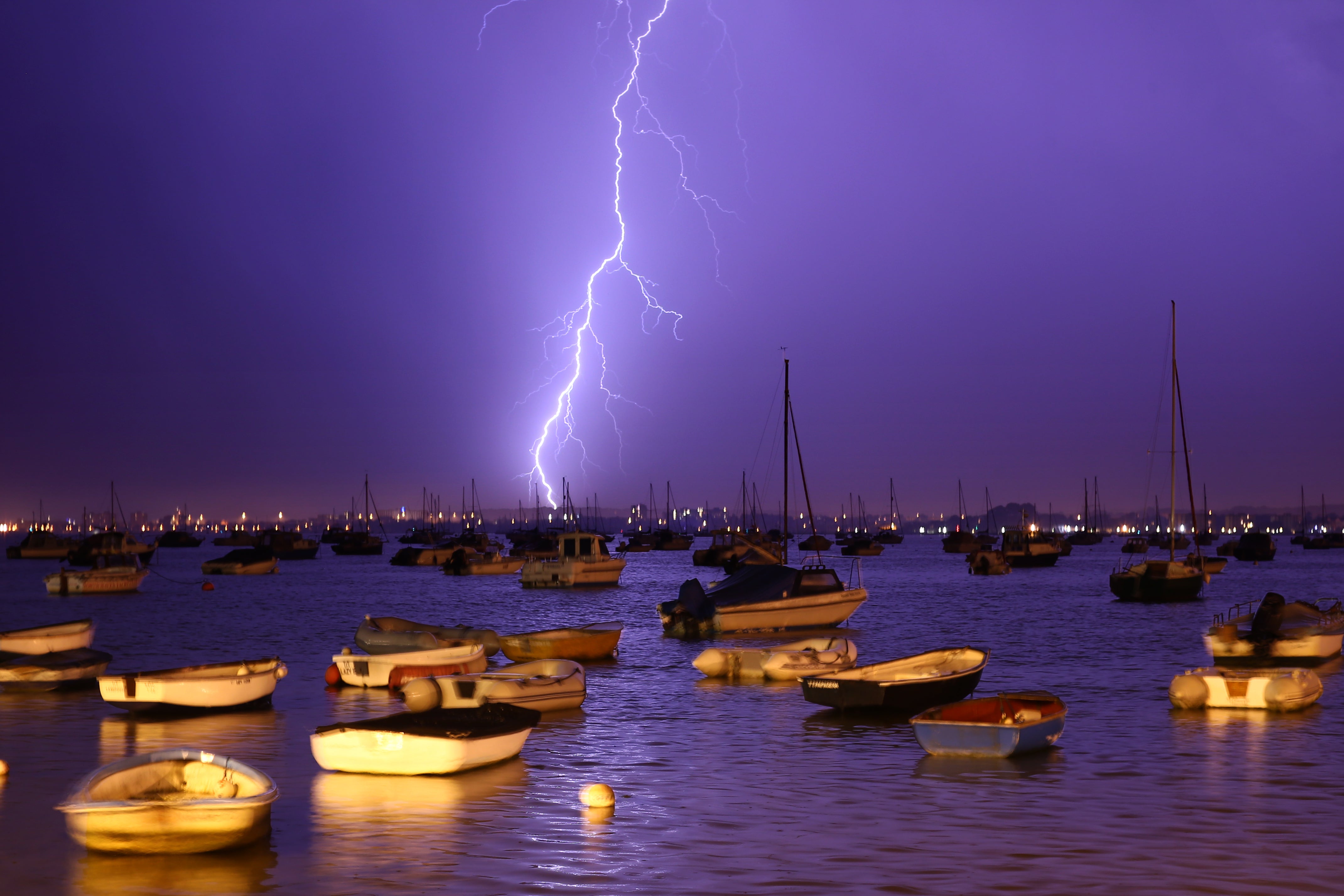Lightning strikes over Poole Harbour during a thunderstorm