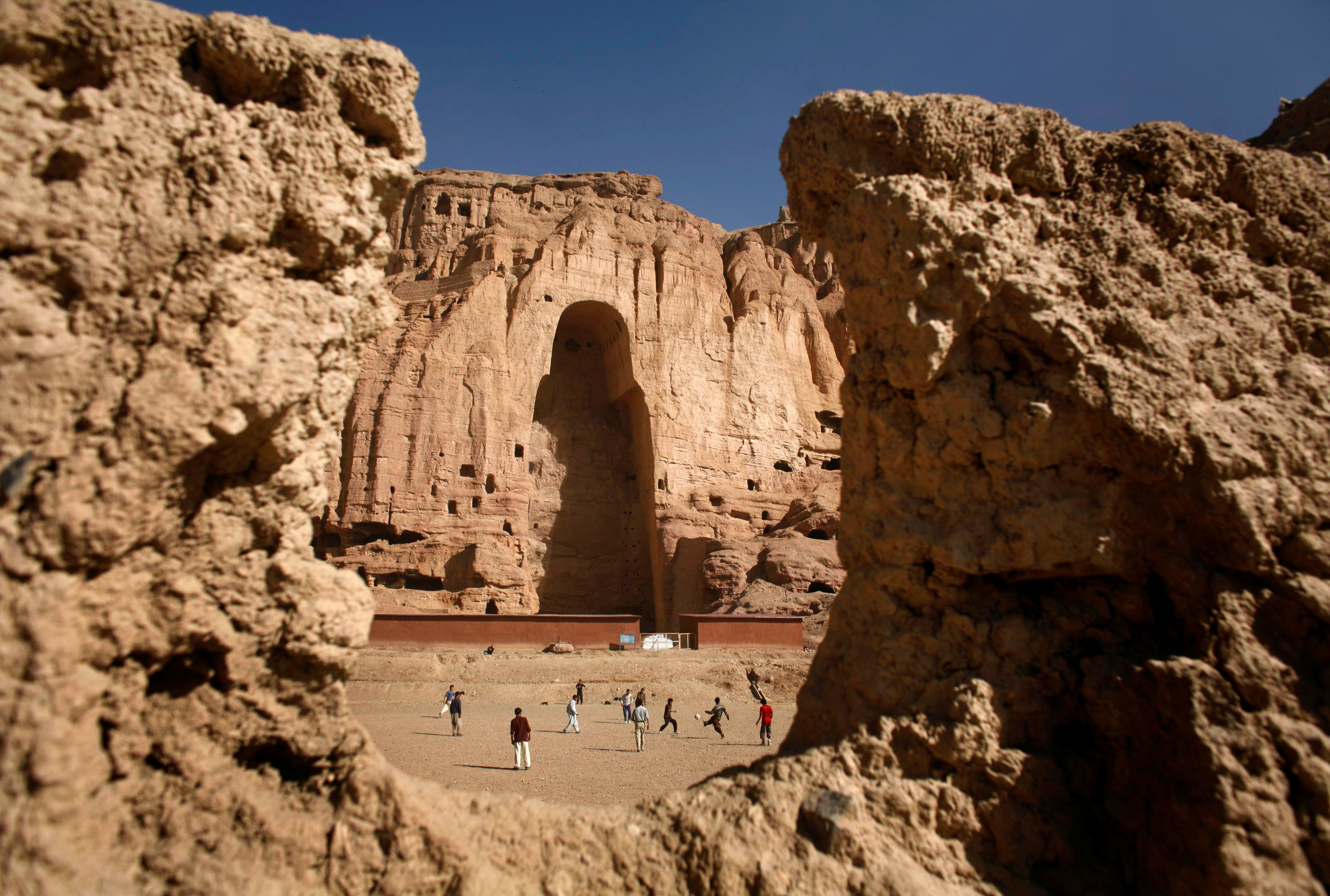 <p>File Afghan boys play soccer in front of the gaping niche where a giant Buddha statue used to stand in the central town of Bamiyan some 240 km (149 miles) northwest of Kabul April 13, 2007</p>