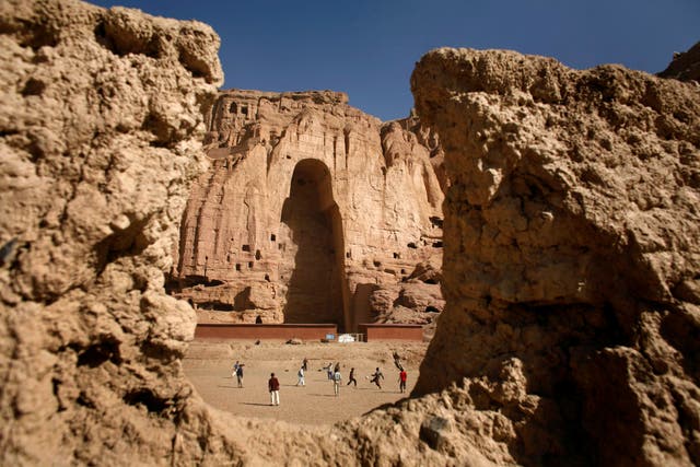 <p>File Afghan boys play soccer in front of the gaping niche where a giant Buddha statue used to stand in the central town of Bamiyan some 240 km (149 miles) northwest of Kabul April 13, 2007</p>