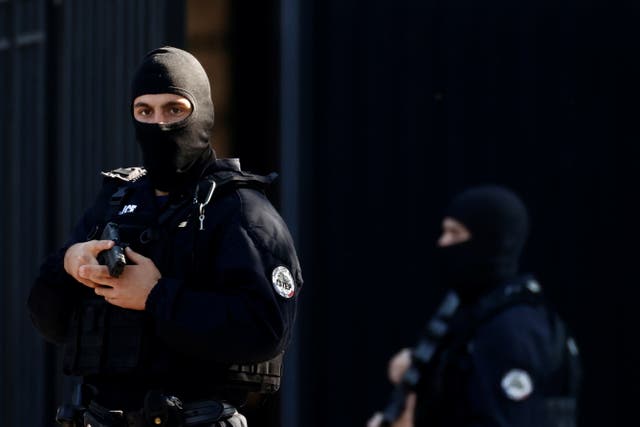 <p>French Police secure near the Paris courthouse on the Ile de la Cite during the arrival of a convoy believed to be carrying the defendants who stand trial over November 2015 terror attacks</p>