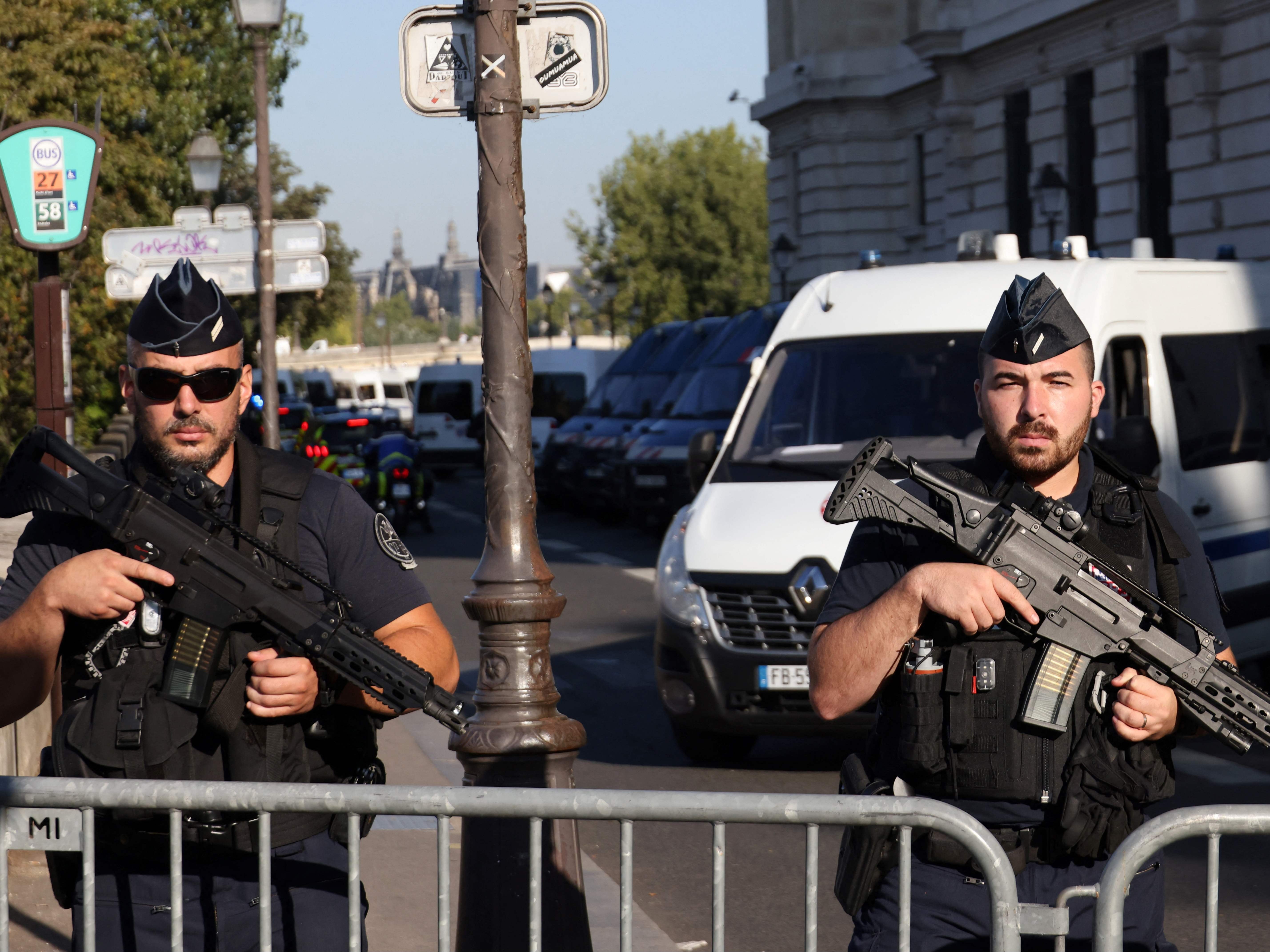 French Gendarmes officers stand guard outside the Palais de Justice of Paris