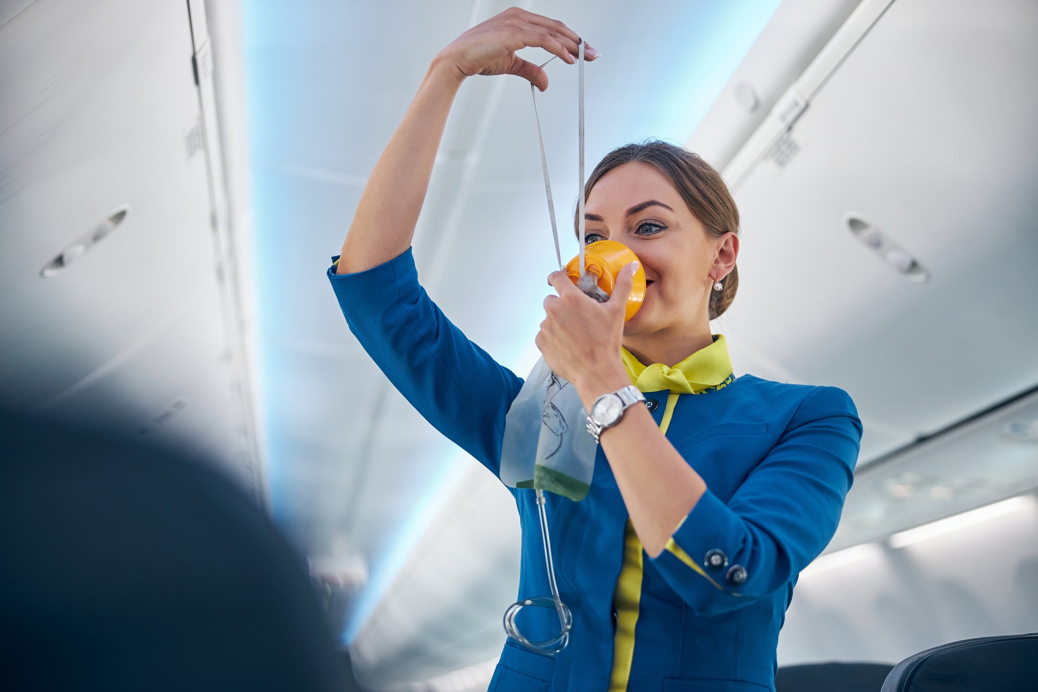 An air steward ‘dances’ onboard a commercial flight