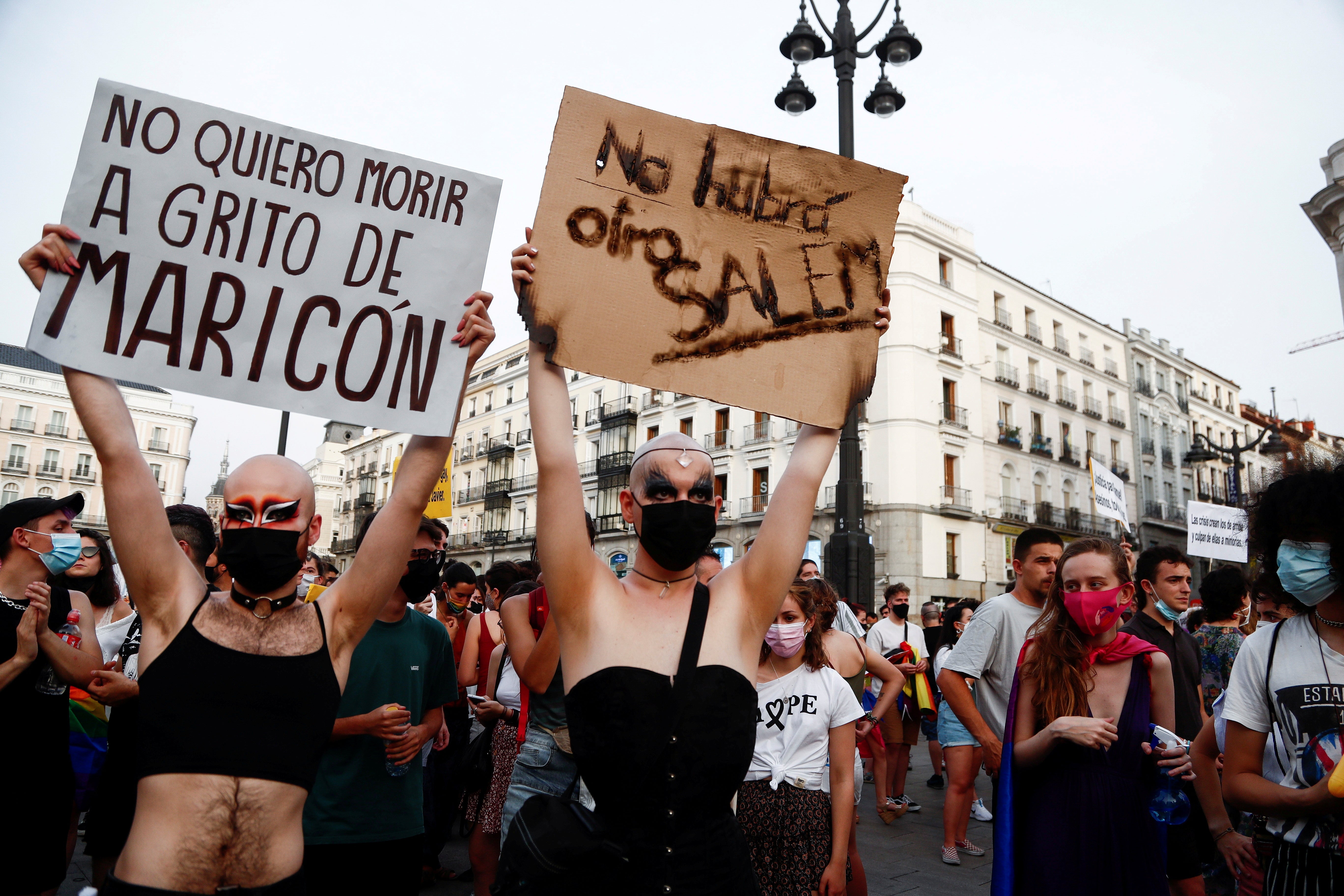 LGBT activists protest against homophobic crimes in Madrid in July. The signs read “I don’t want to die while being called ‘f****t’” and “there will not be another Salem”