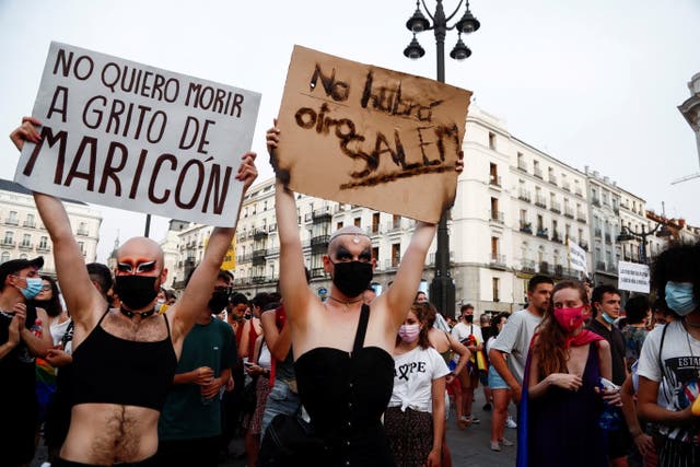 <p>LGBT activists protest against homophobic crimes in Madrid in July. The signs read “I don’t want to die while being called ‘f****t’” and “there will not be another Salem”</p>