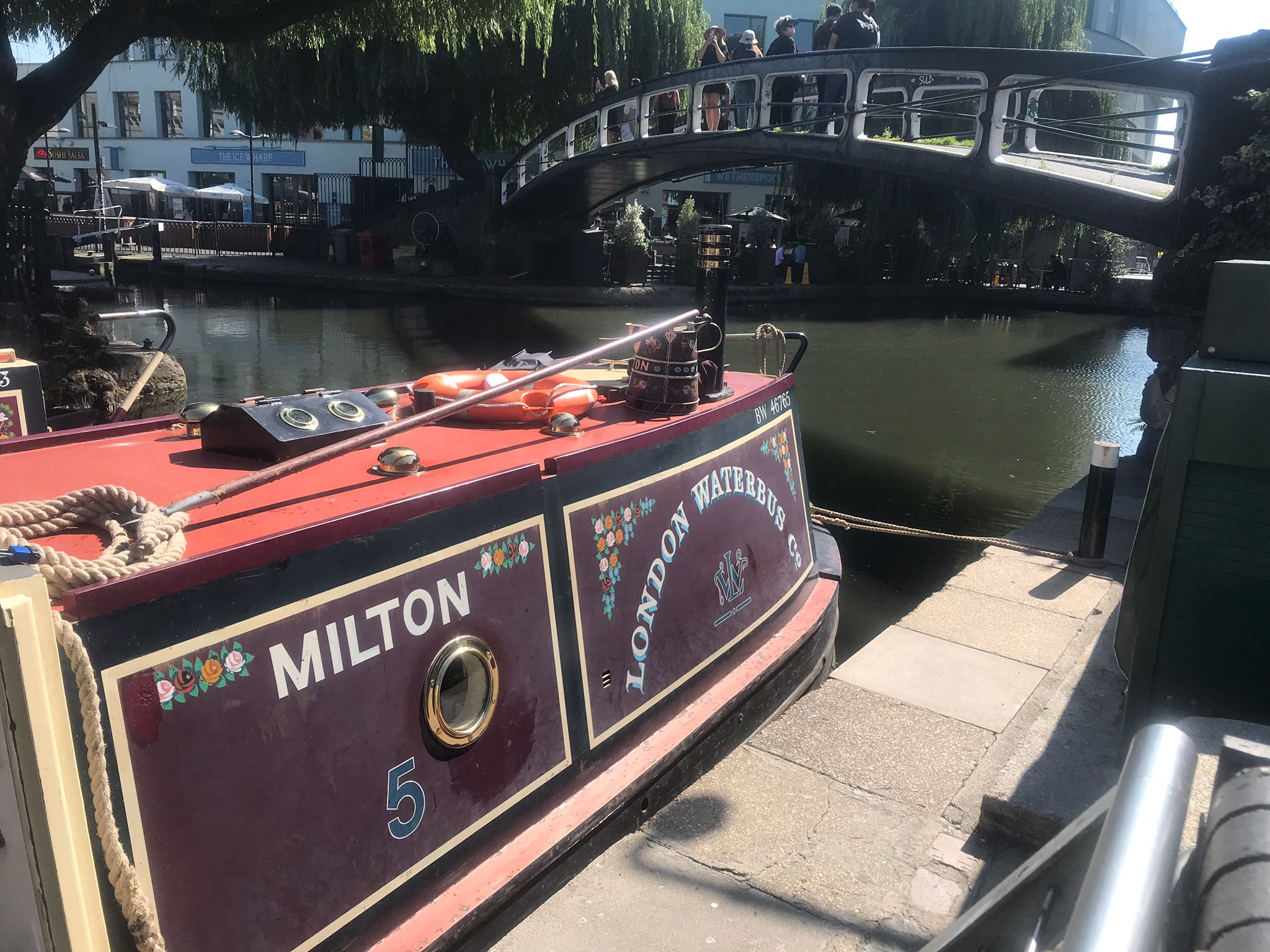 Tourists queued to ride narrowboats along a North London canal