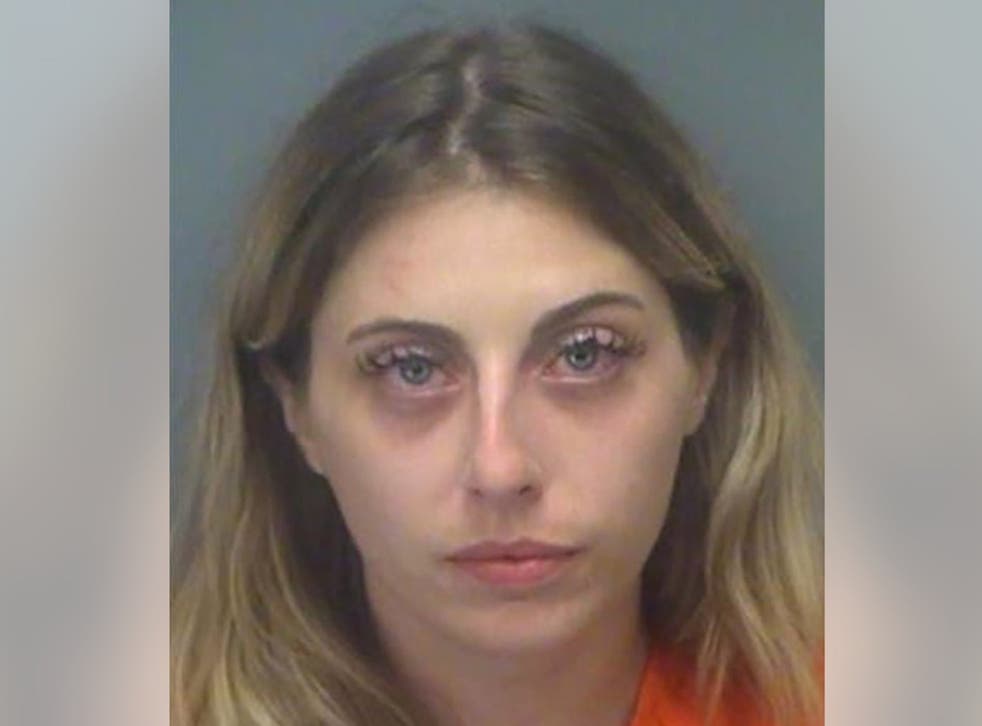 Police: Naked Florida woman drives golf cart through armed 