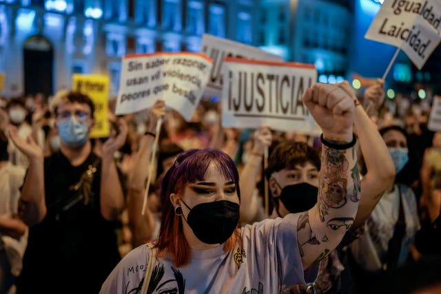 <p>Dozens gathered at Sol square in Madrid on Wednesday night to protest against a rise in LGBT+ hate crimes </p>