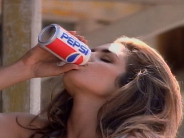 <p>Supermodel Cindy Crawford drinks a Pepsi in an award-winning ad produced for regular Pepsi in 1992, in which a pair of awestruck boys watched Crawford approach a Pepsi vending machine</p>
