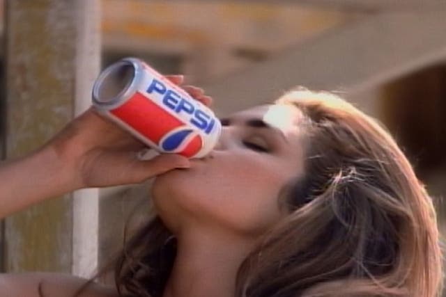 <p>Supermodel Cindy Crawford drinks a Pepsi in an award-winning ad produced for regular Pepsi in 1992, in which a pair of awestruck boys watched Crawford approach a Pepsi vending machine</p>