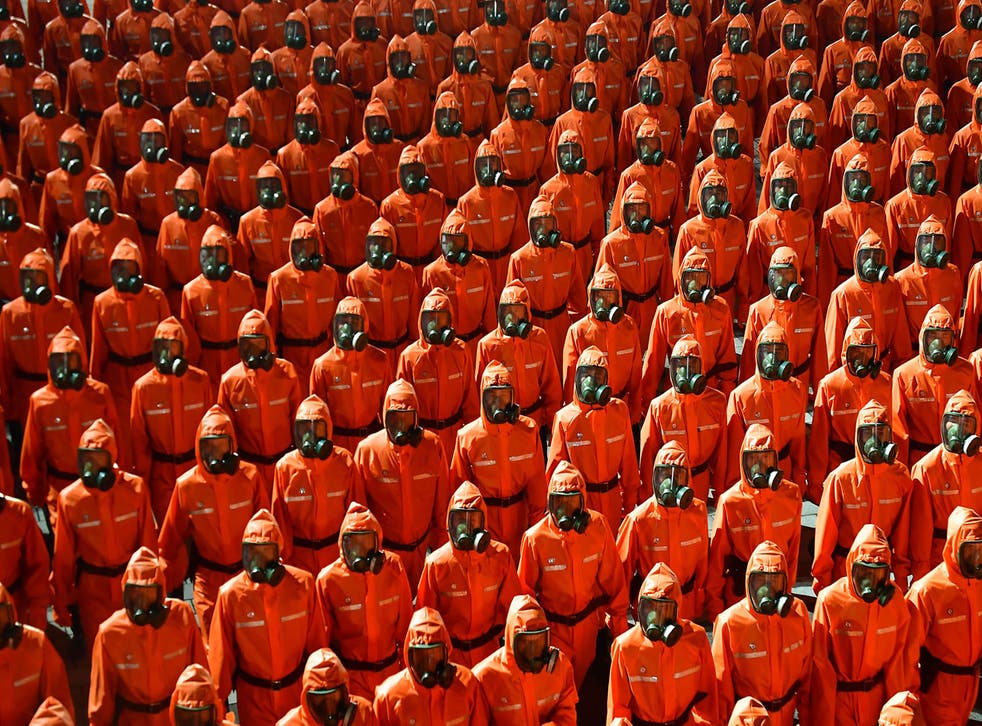 North Korea stages midnight military parade in Pyongyang featuring hazmat suits, gas masks | The Independent